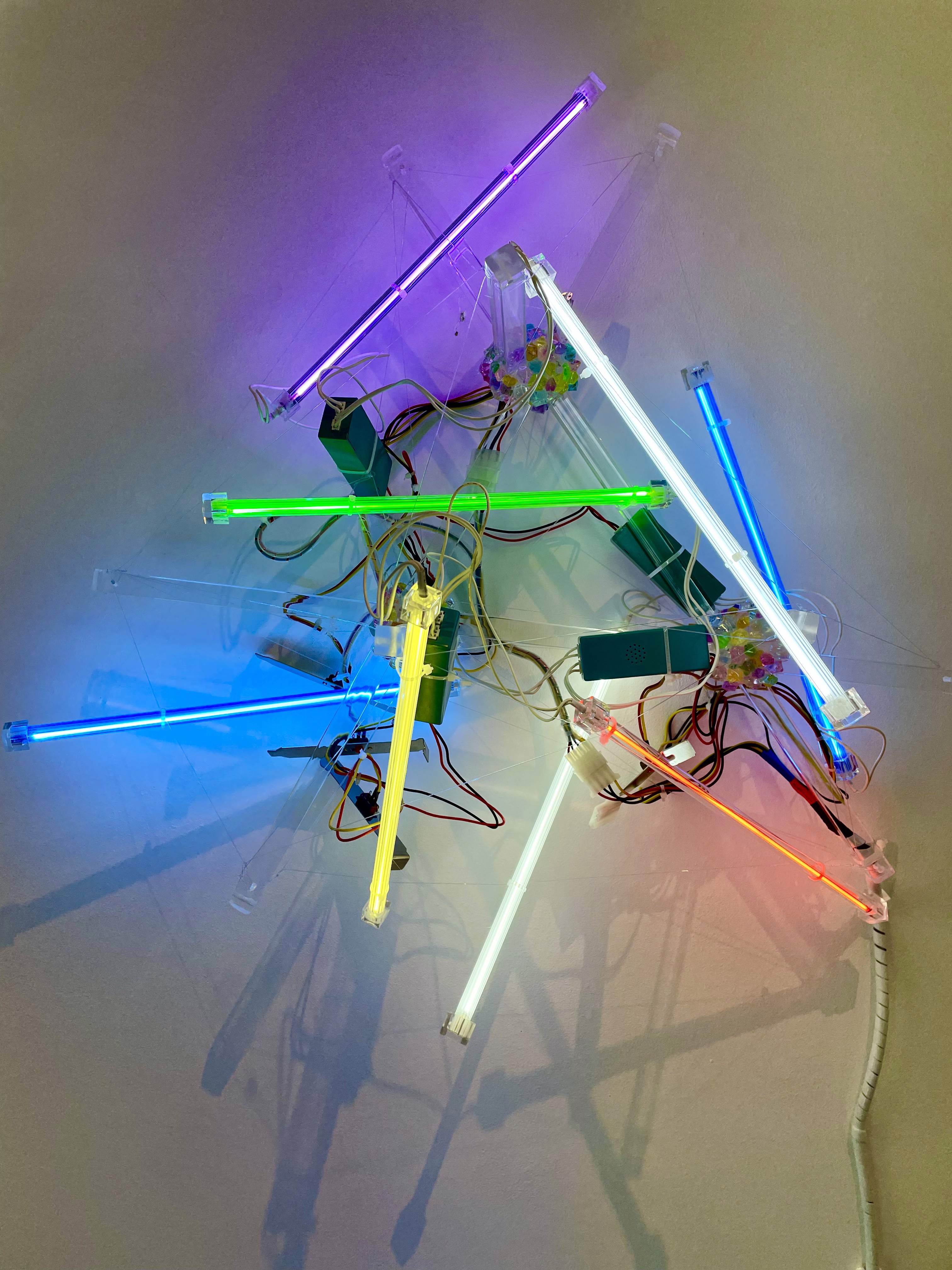 A bunch of different colored lights that are on a wall.