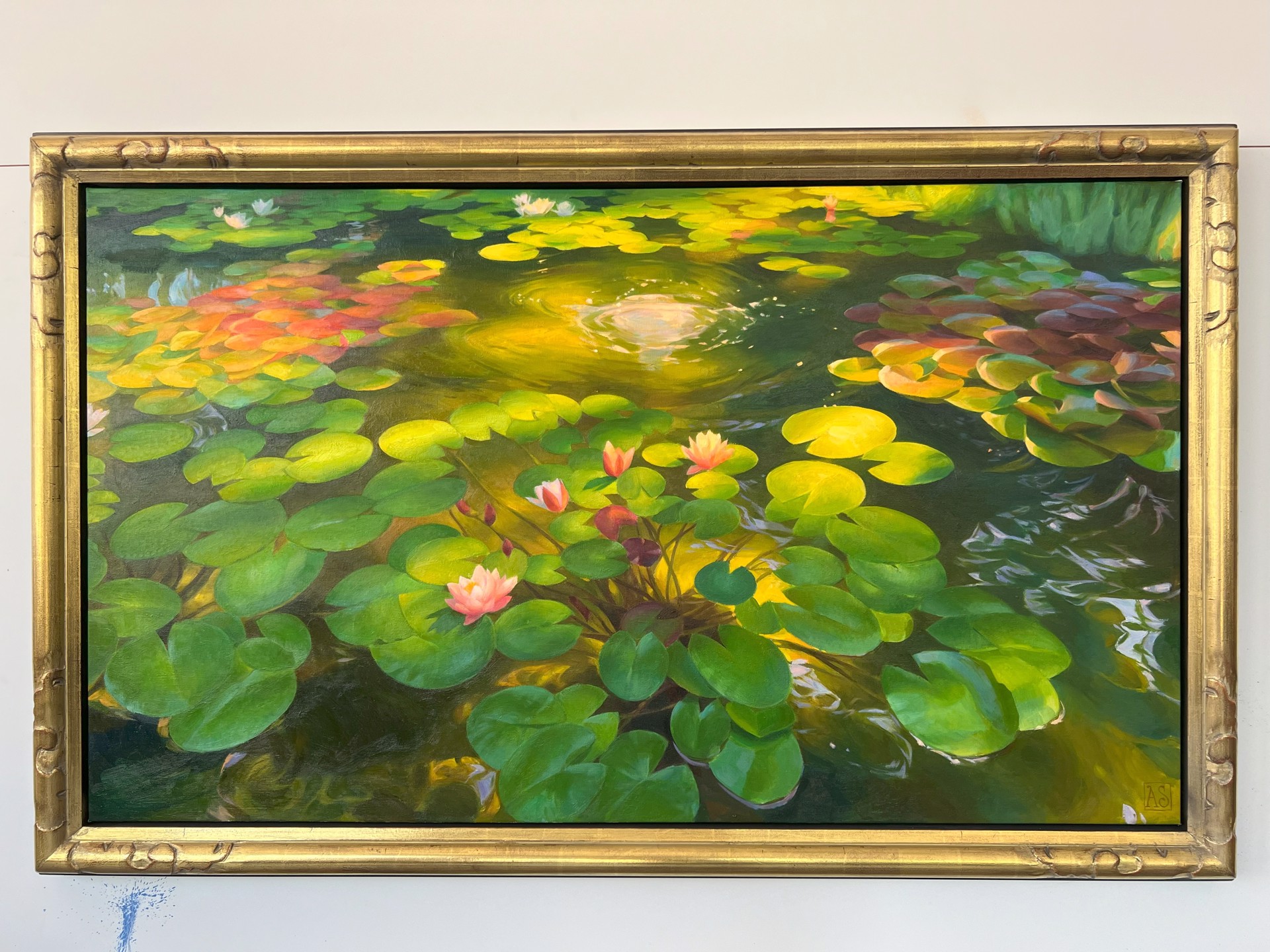 A painting of water lilies in a pond of water.