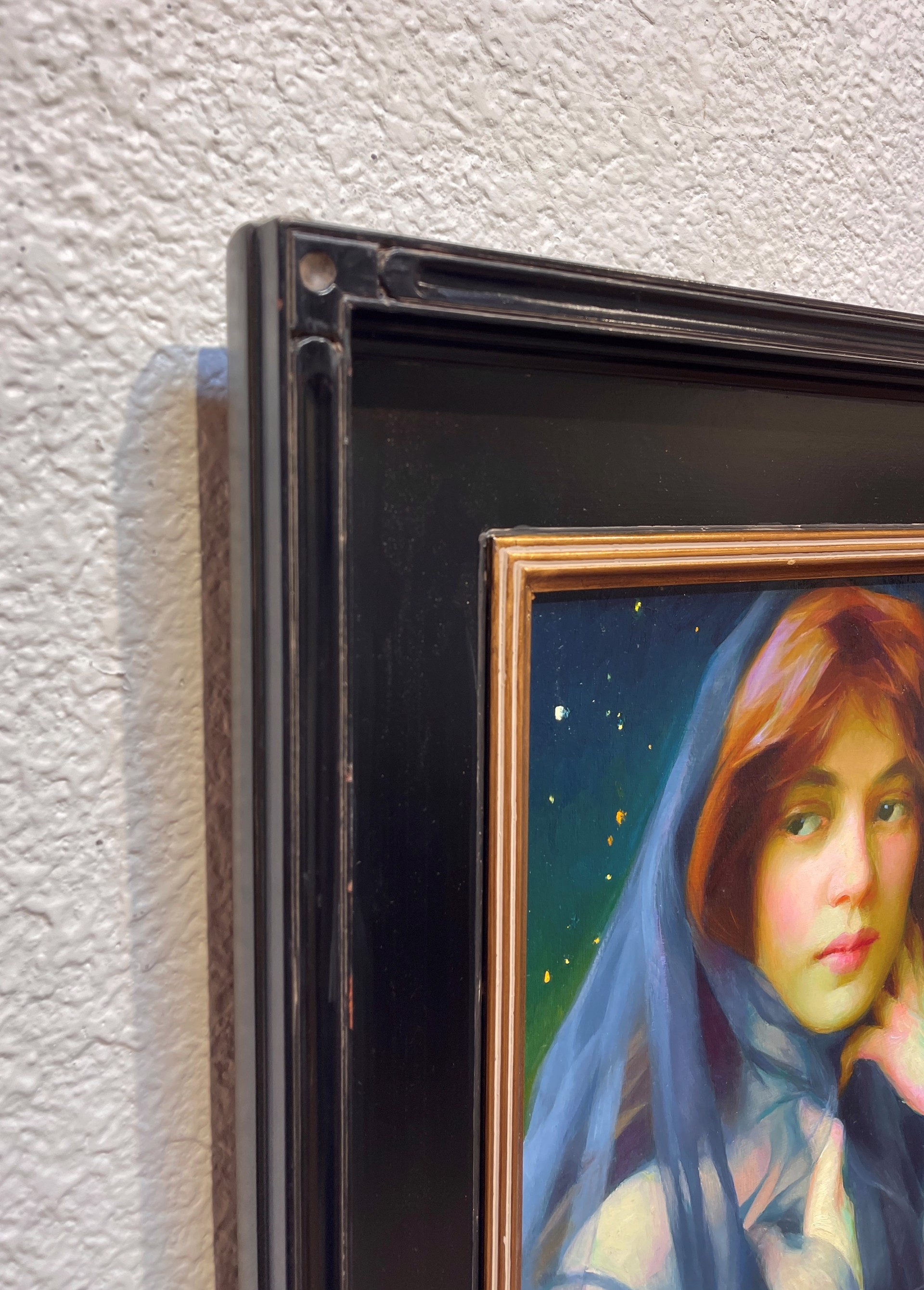 A painting of a woman with a veil over her head.