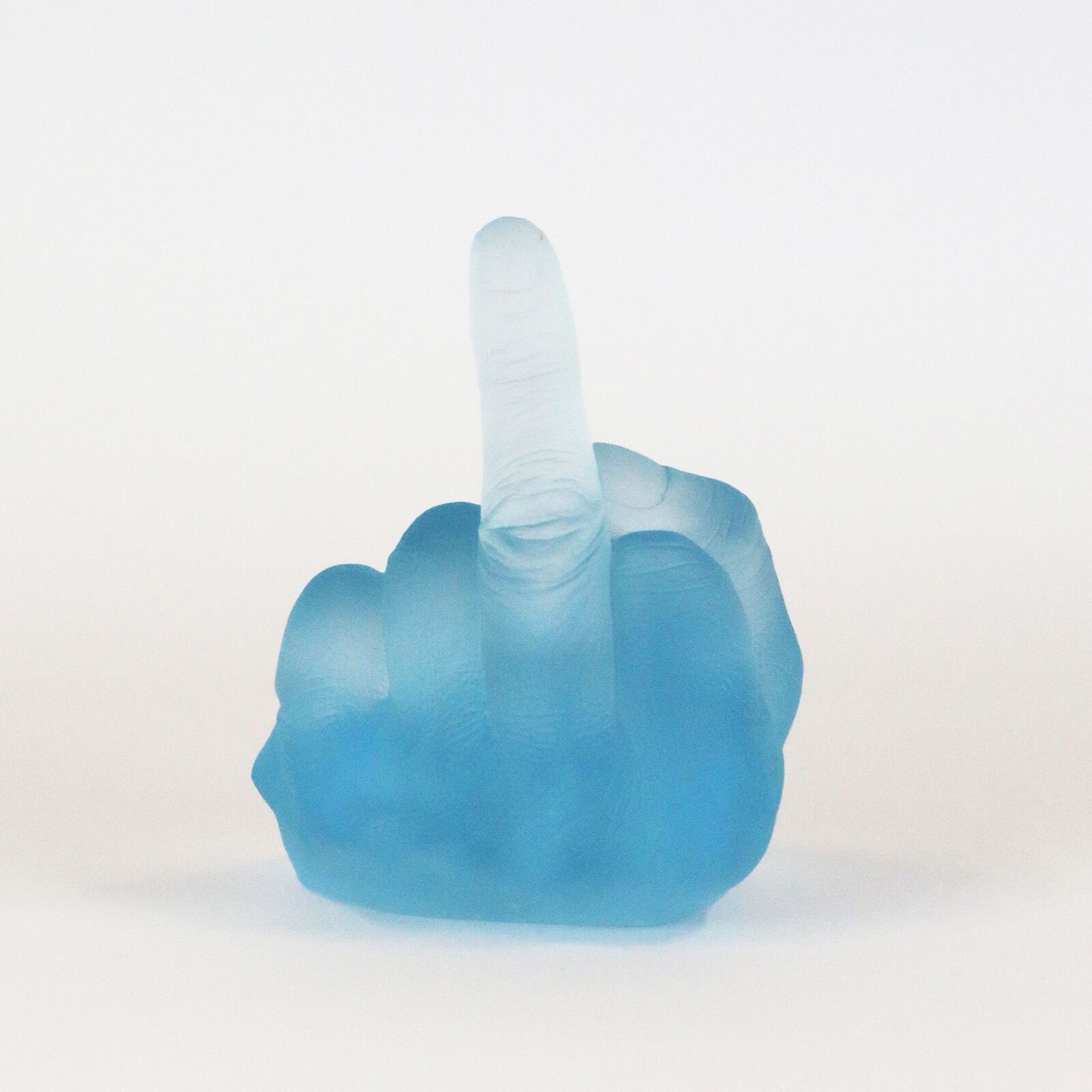 A row of six translucent, colorful hand sculptures in the middle finger gesture.