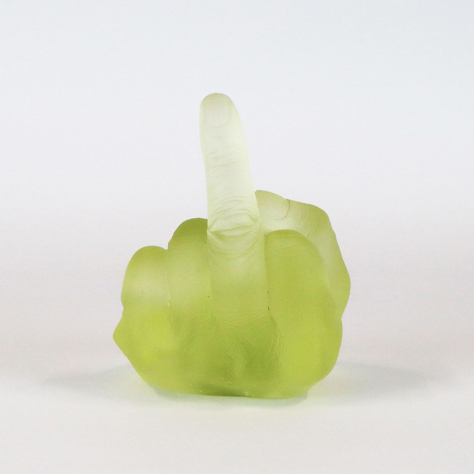 A row of six translucent, colorful hand sculptures in the middle finger gesture.