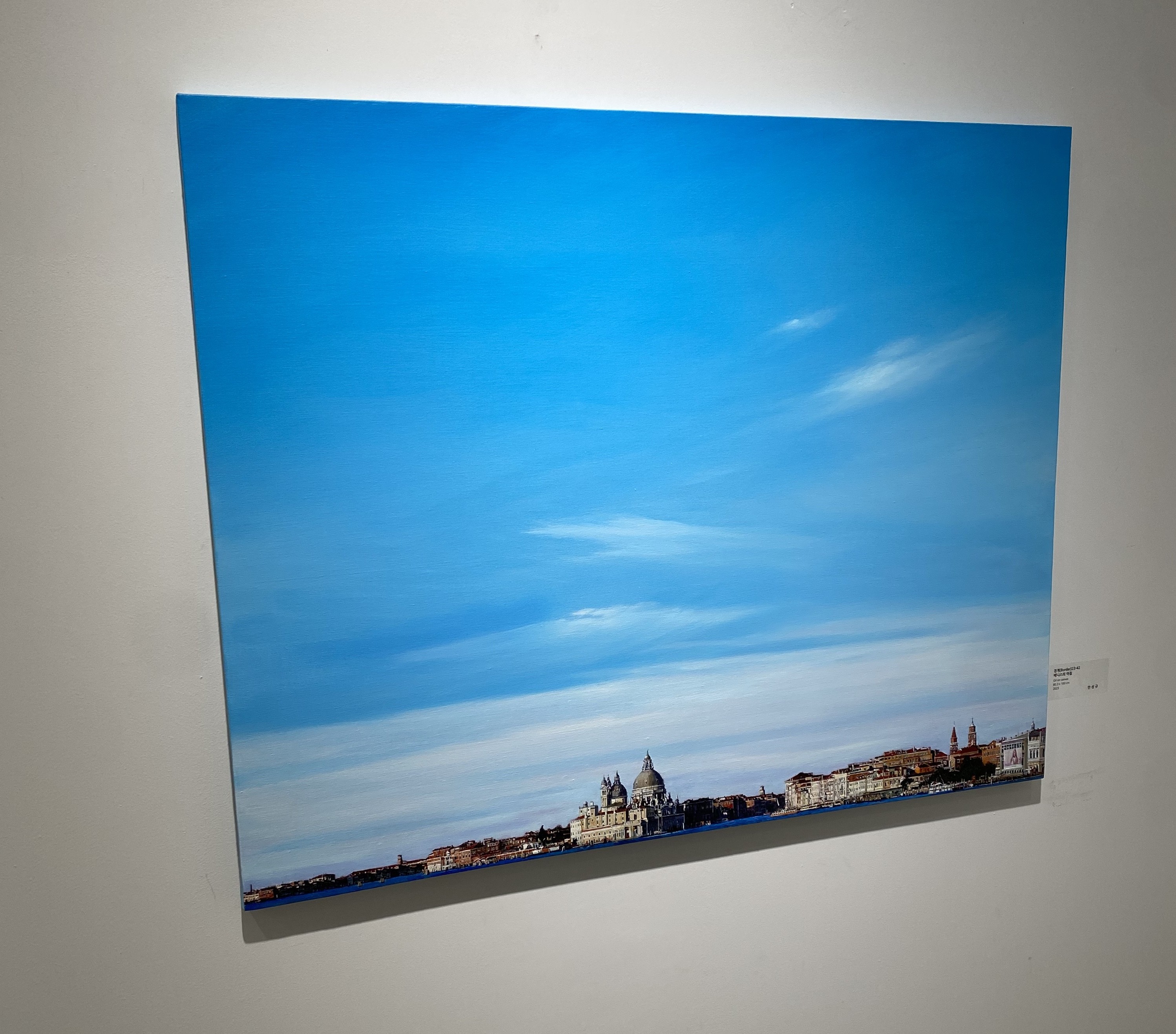 A picture hanging on a wall in a room.
