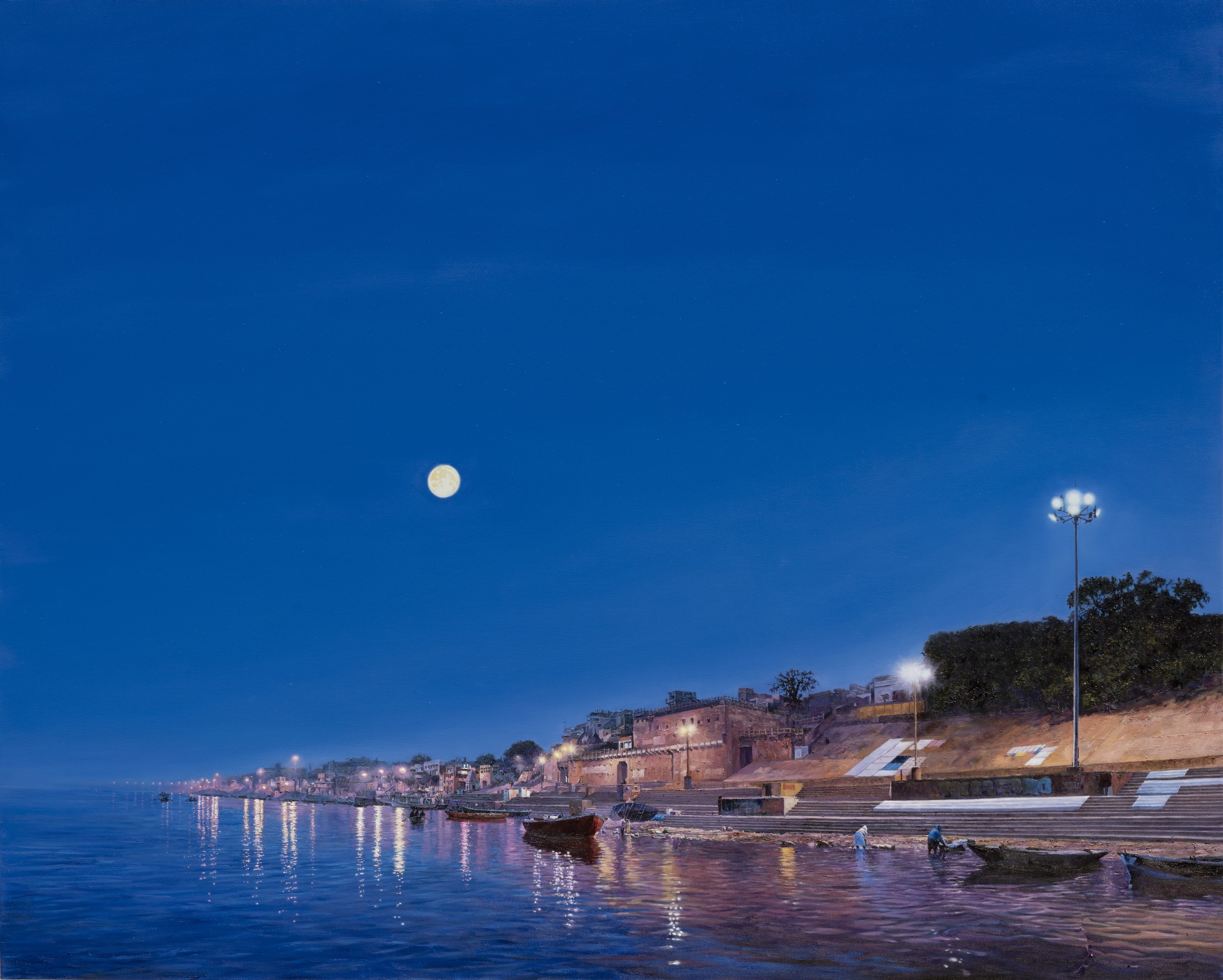 A large picture hanging on a wall above a body of water.