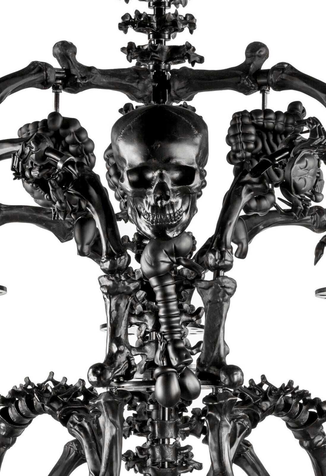 A black chandelier with skulls hanging from the ceiling.