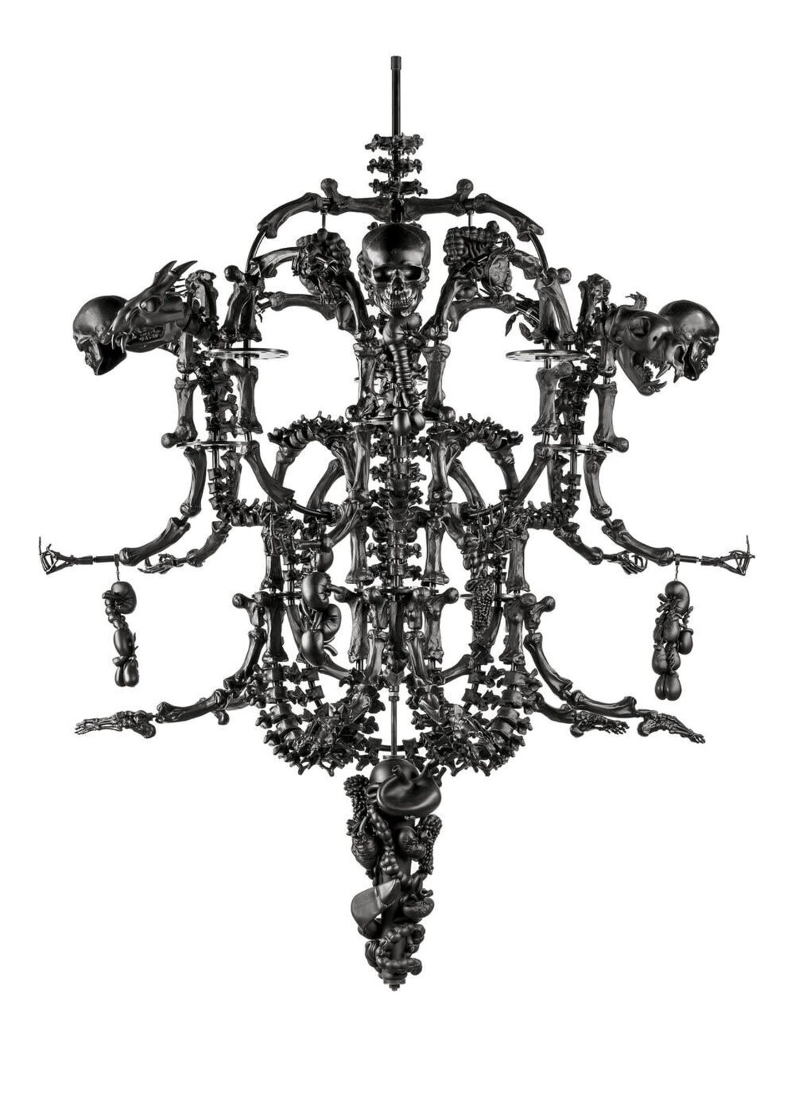 A black chandelier with skulls hanging from the ceiling.