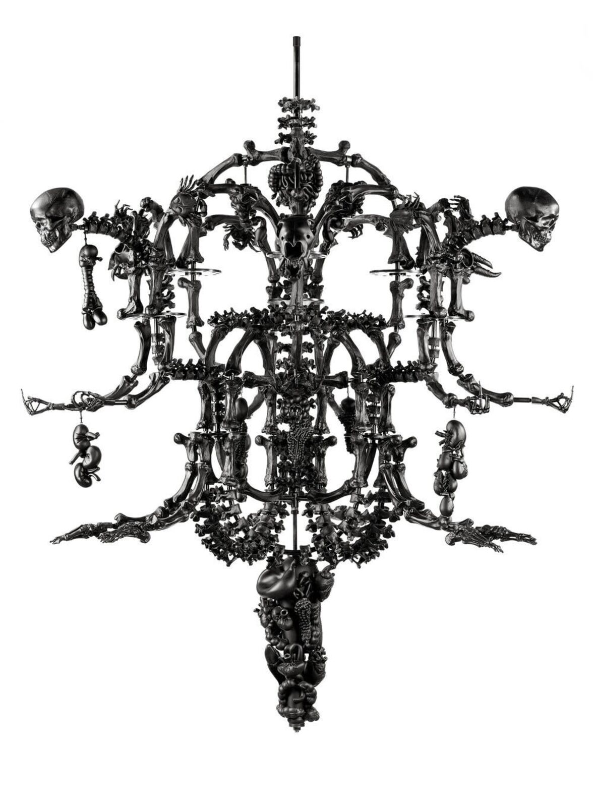 A skeleton chandelier with a skull on top of it.