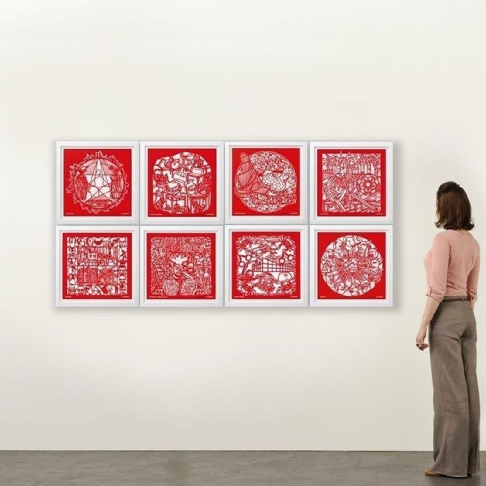 A set of six red paper cut art prints on a white background.