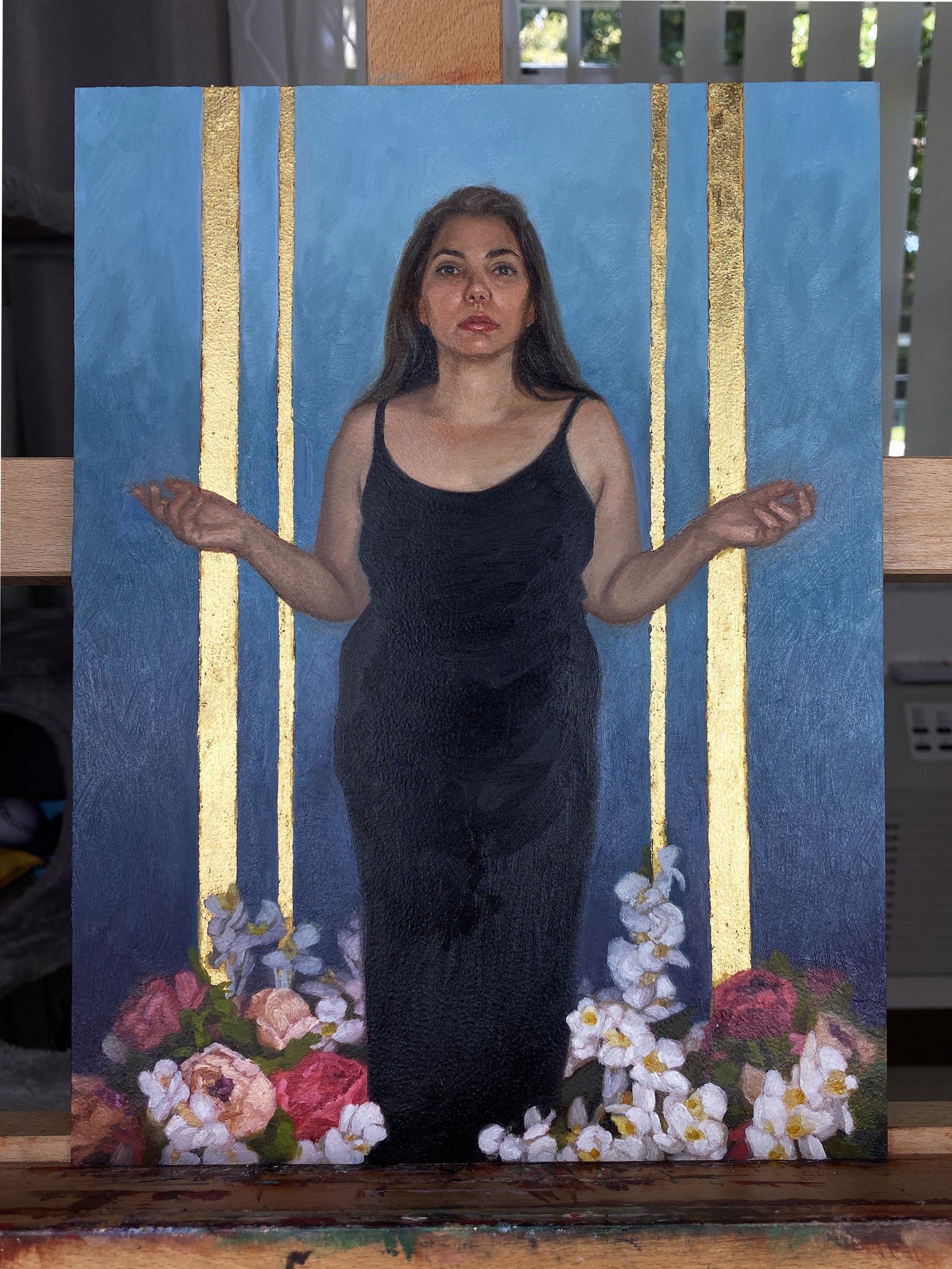 A portrait of a figure in a black dress standing amidst flowers against a blue and gold background.