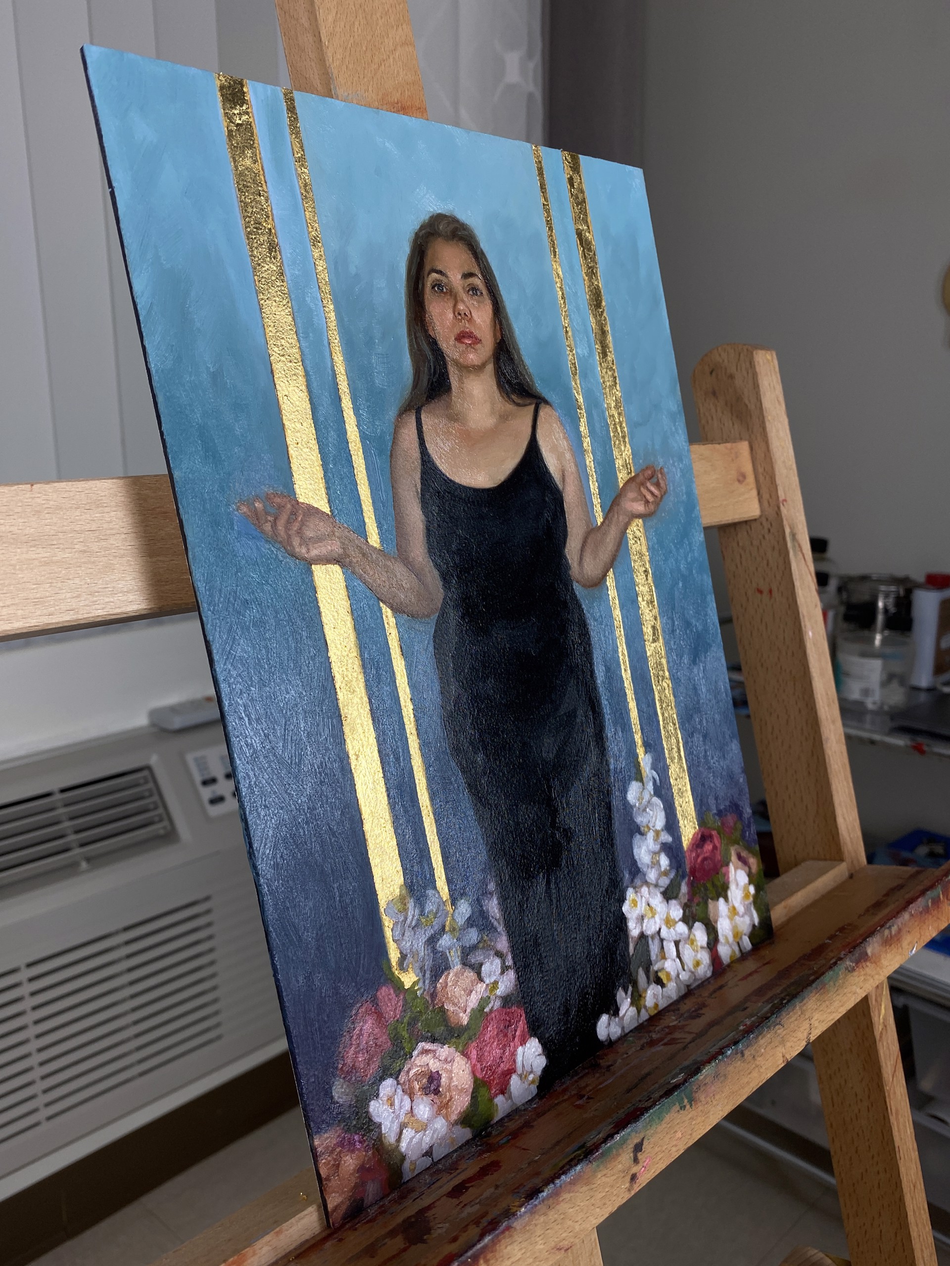 A portrait of a figure in a black dress standing amidst flowers against a blue and gold background.