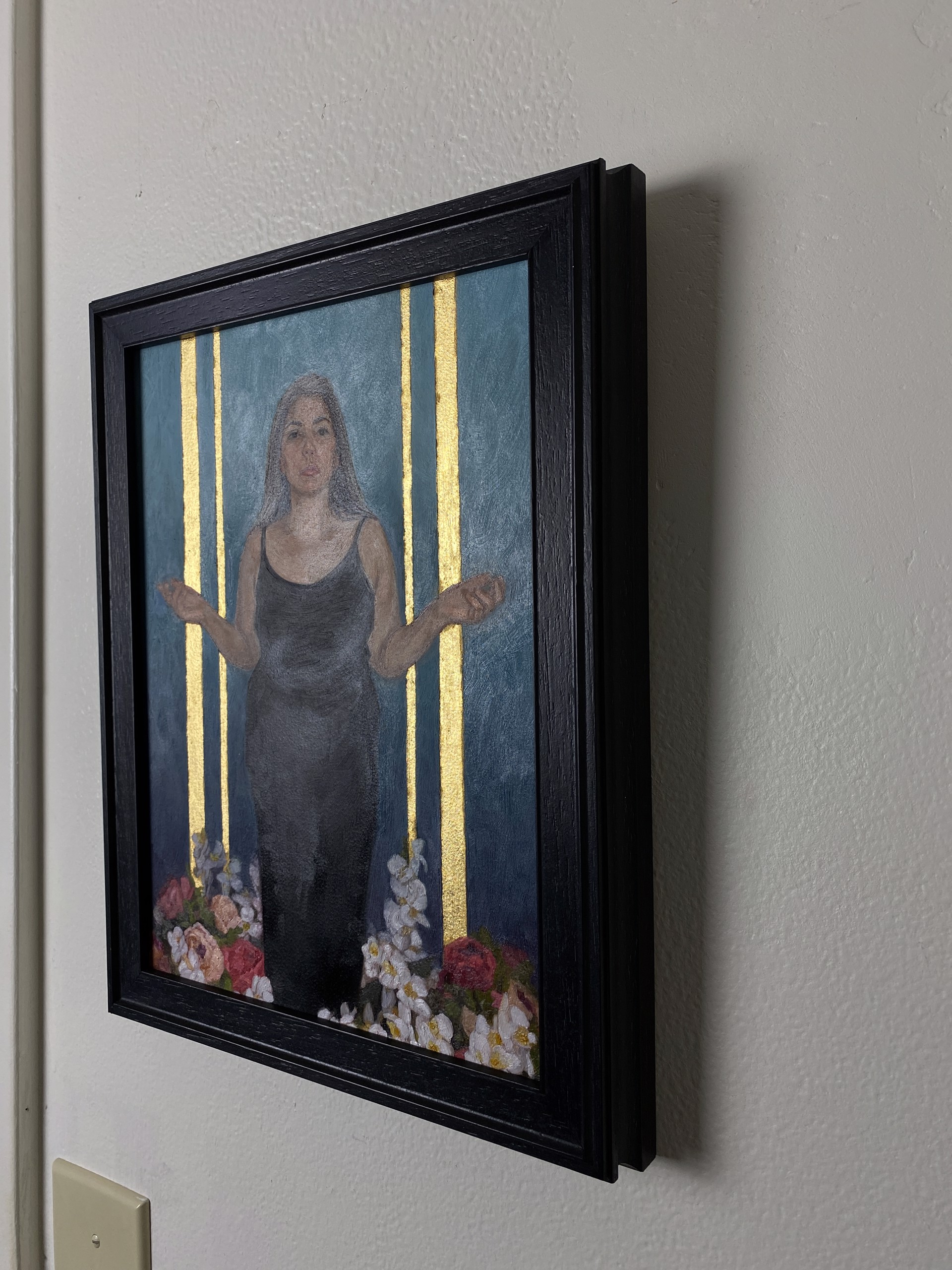 A portrait of a figure in a black dress standing amidst flowers against a blue and gold background.