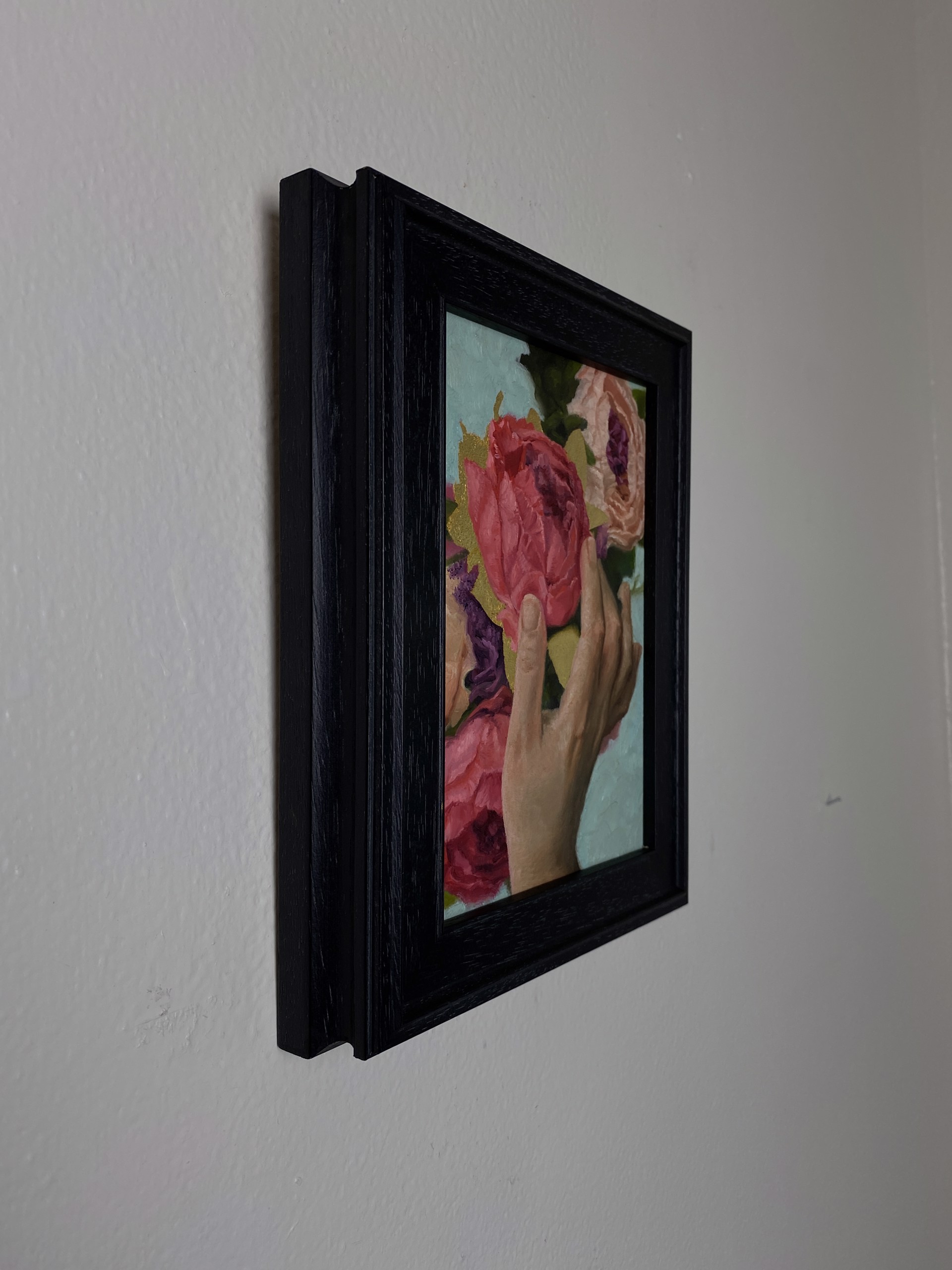 A painting of a person holding a bouquet of flowers.
