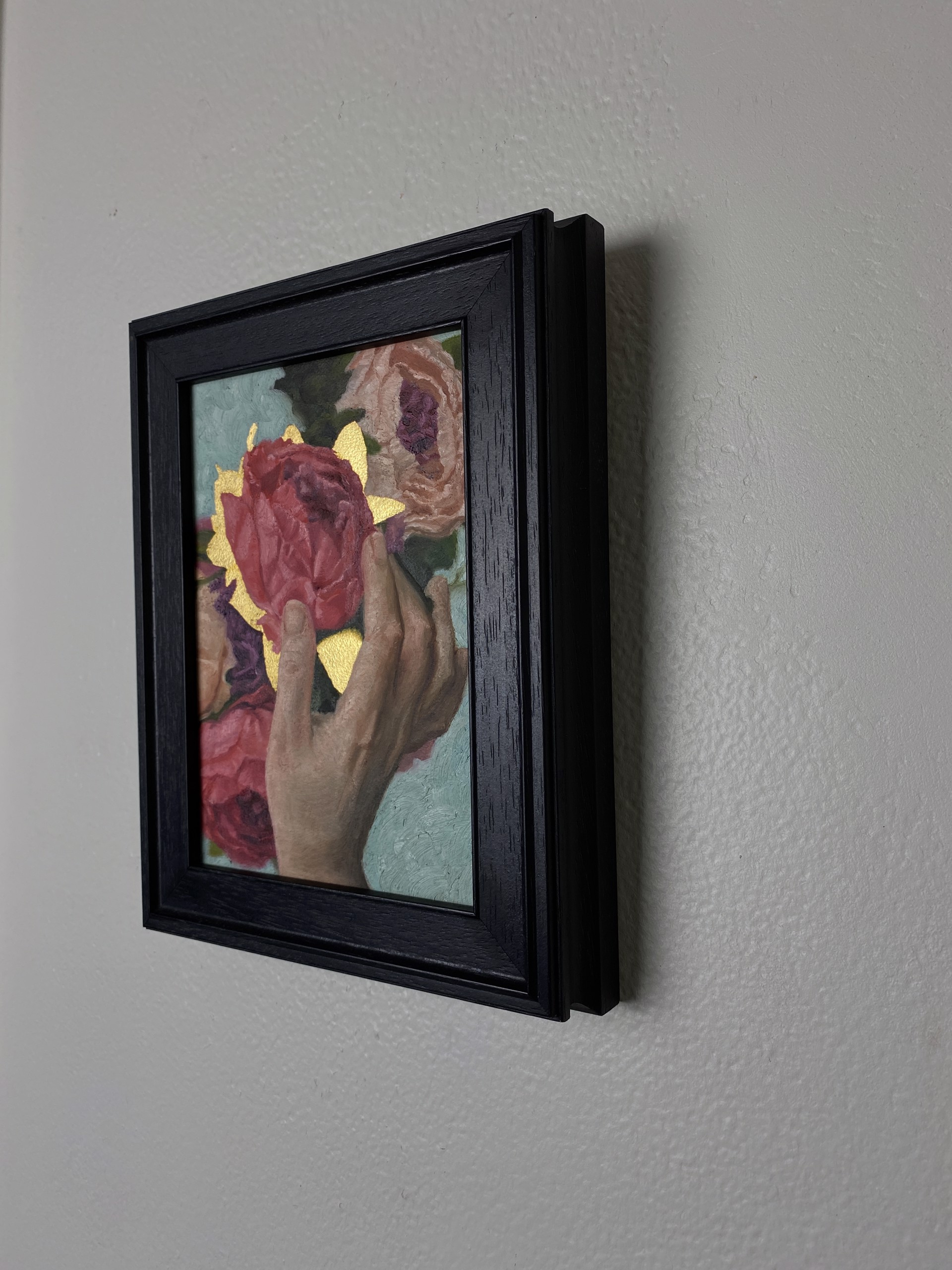 A painting of a person holding a bouquet of flowers.
