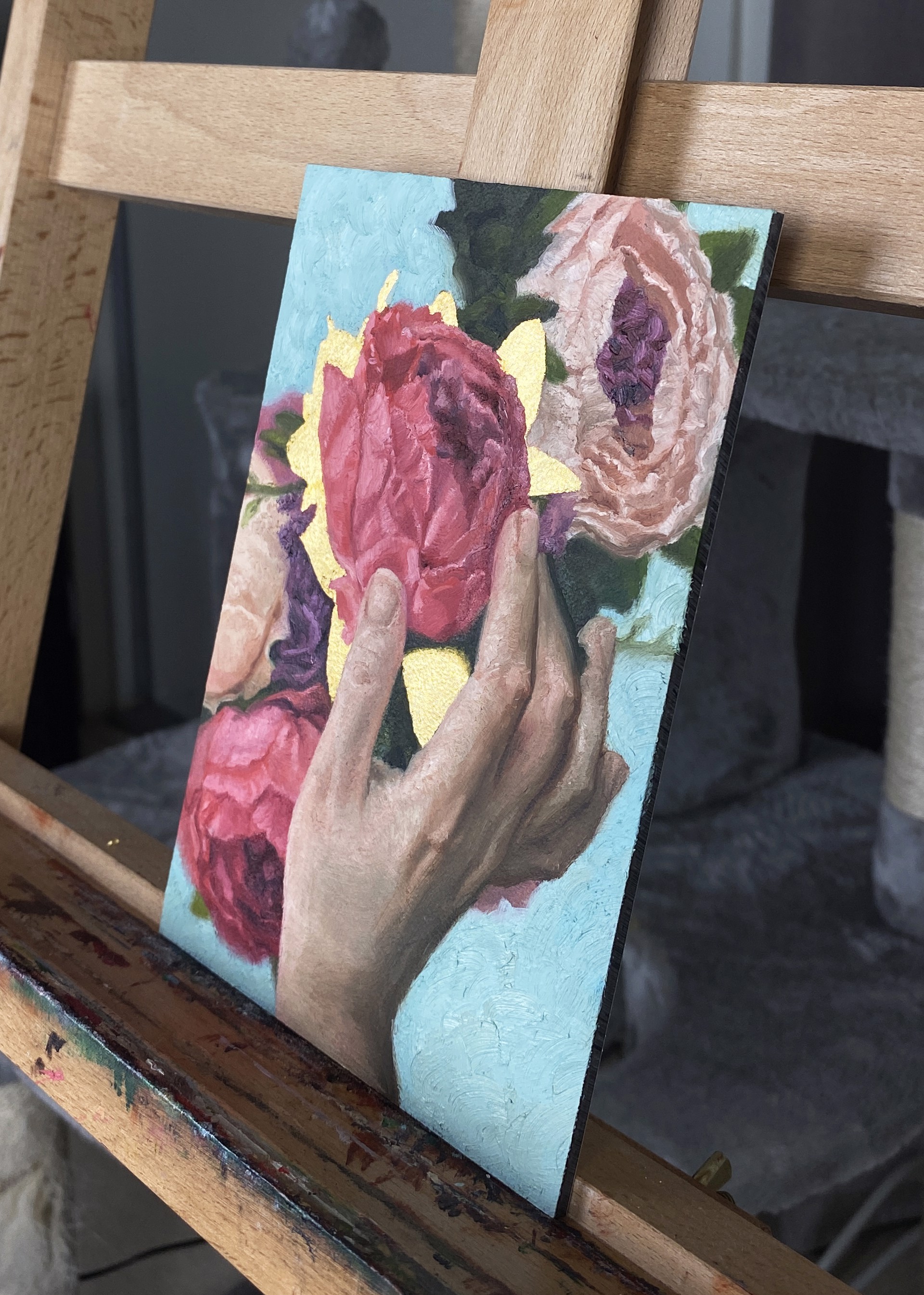 A painting of a person holding a bouquet of flowers.
