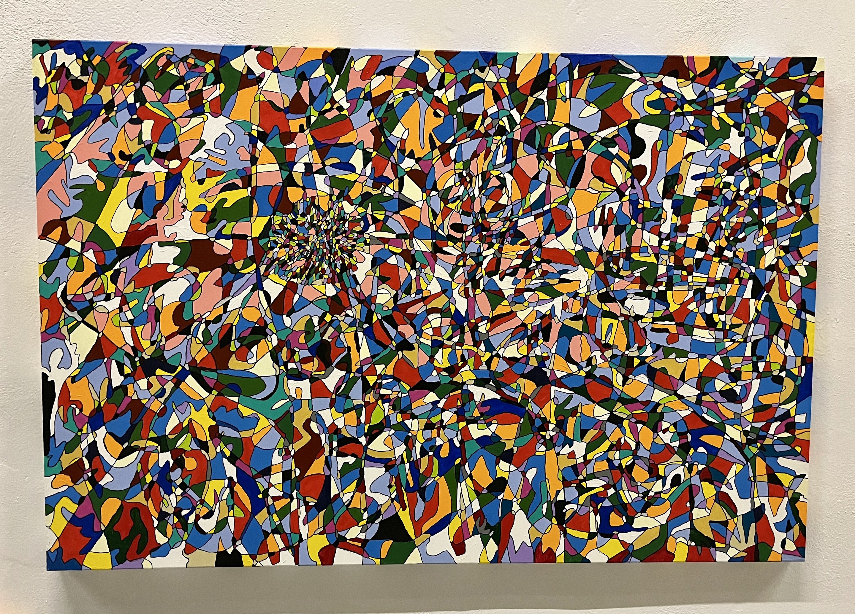 A colorful abstract painting with lots of different colors.