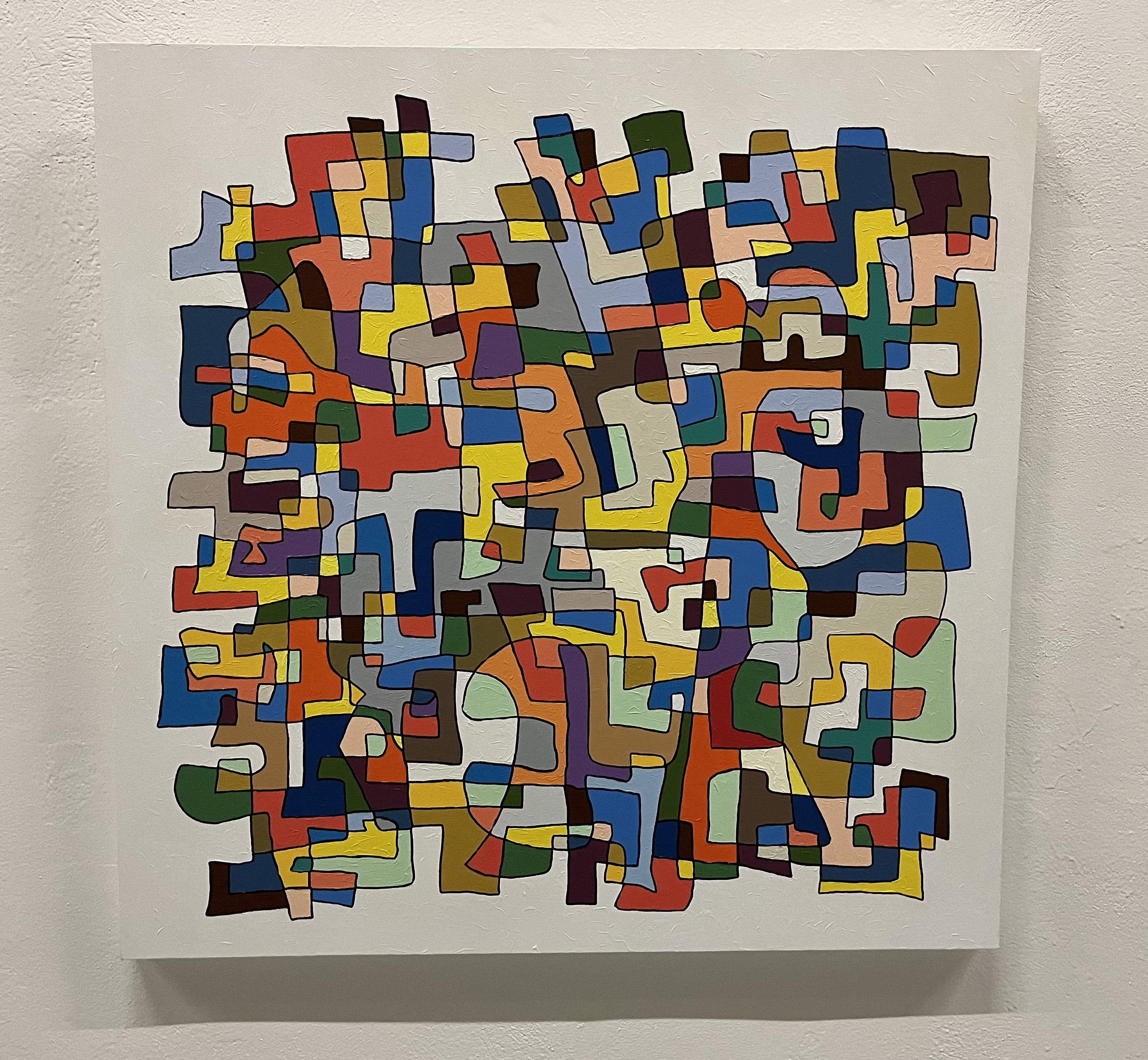 A painting on a white wall with a white background.