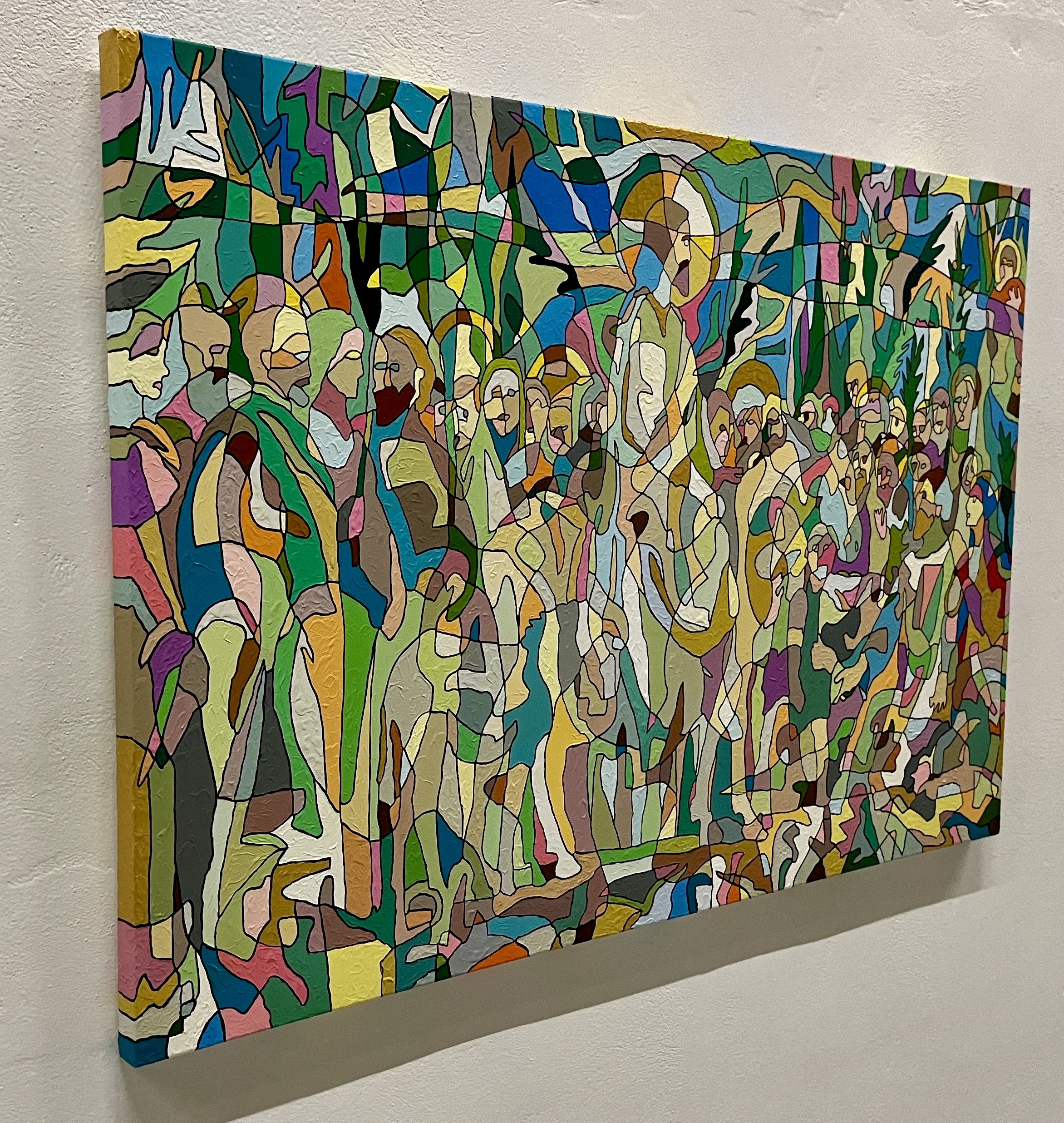 A painting on a wall in a room with a white wall.