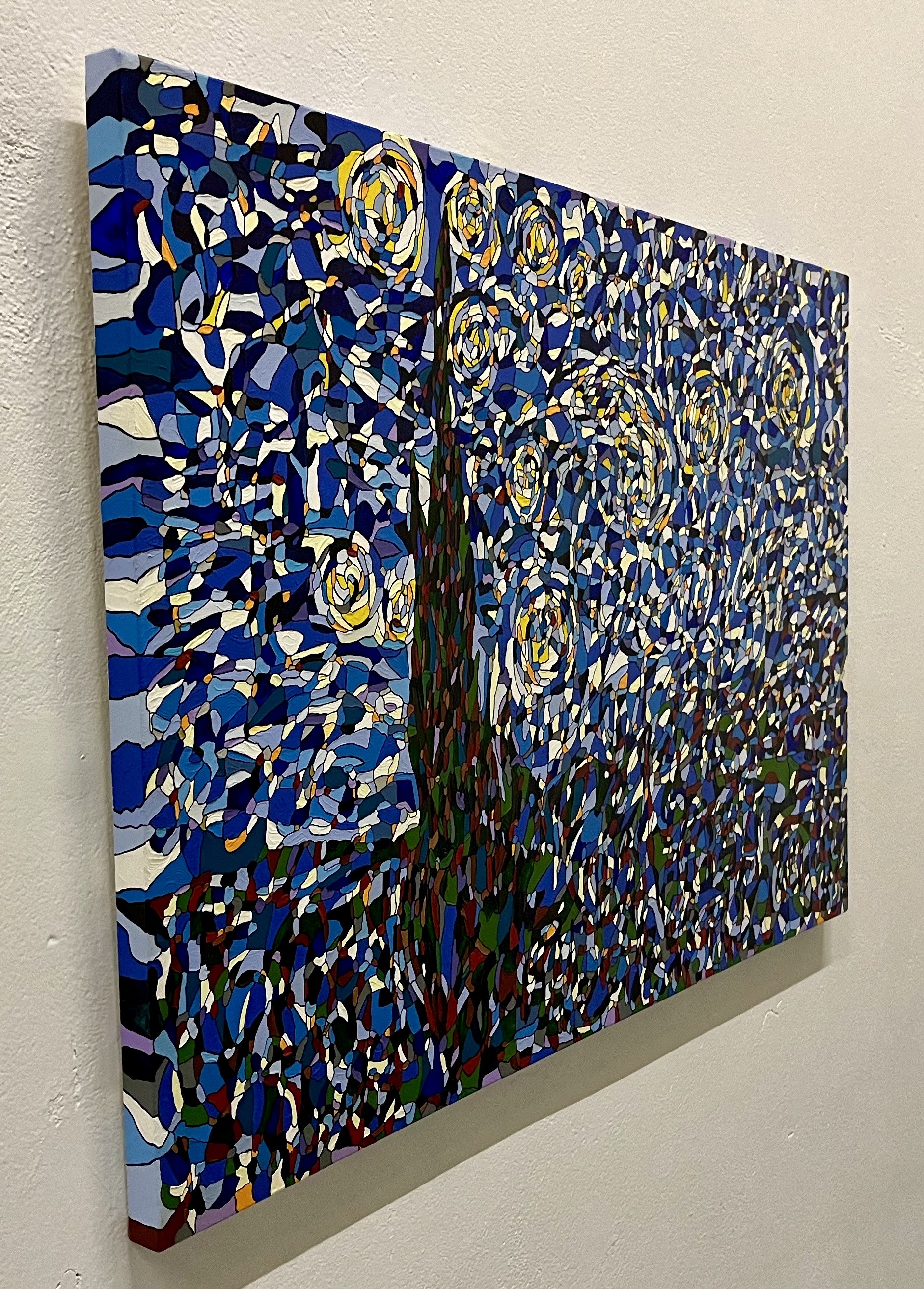 A painting on a wall in a room. 