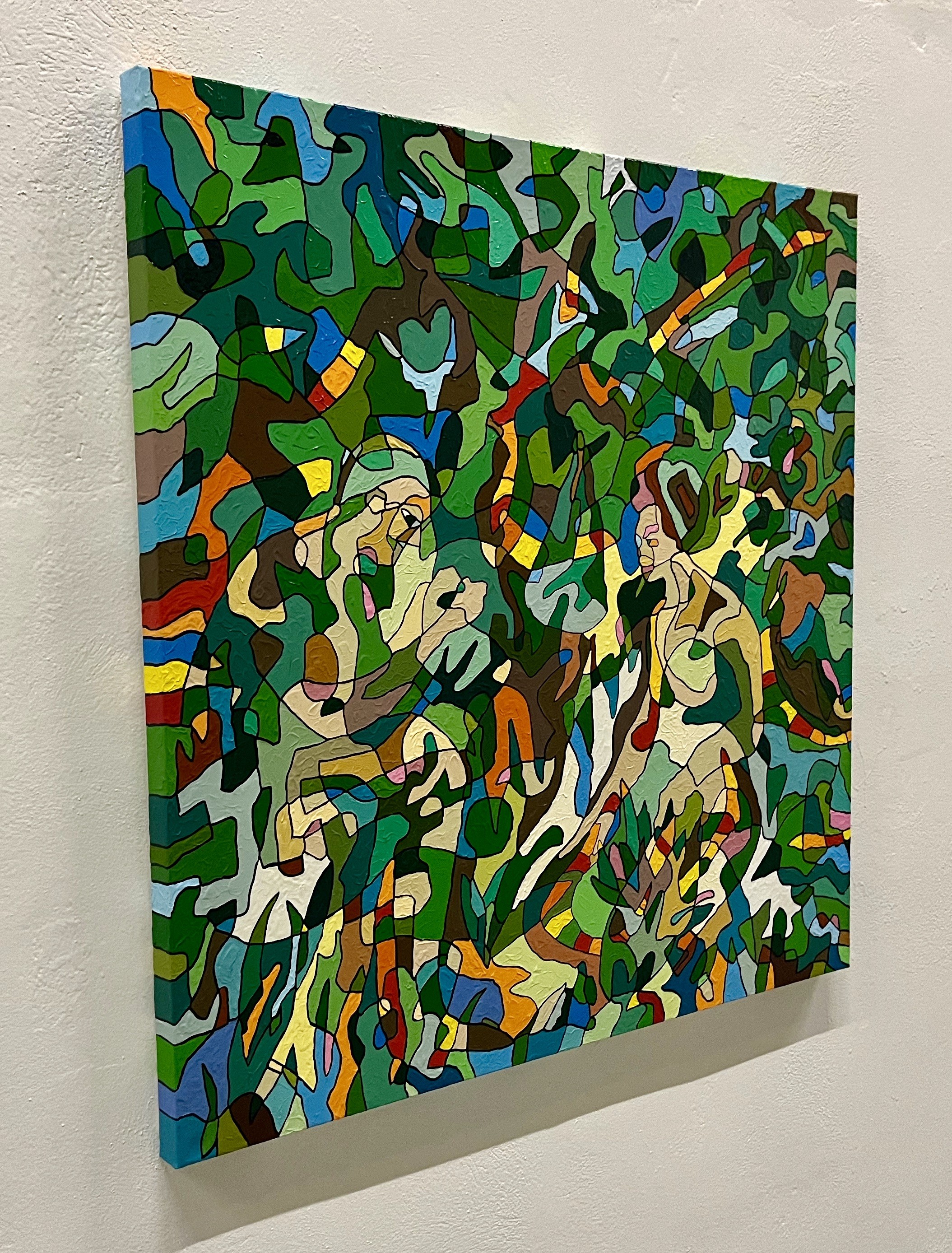 A painting on a wall in a room. 