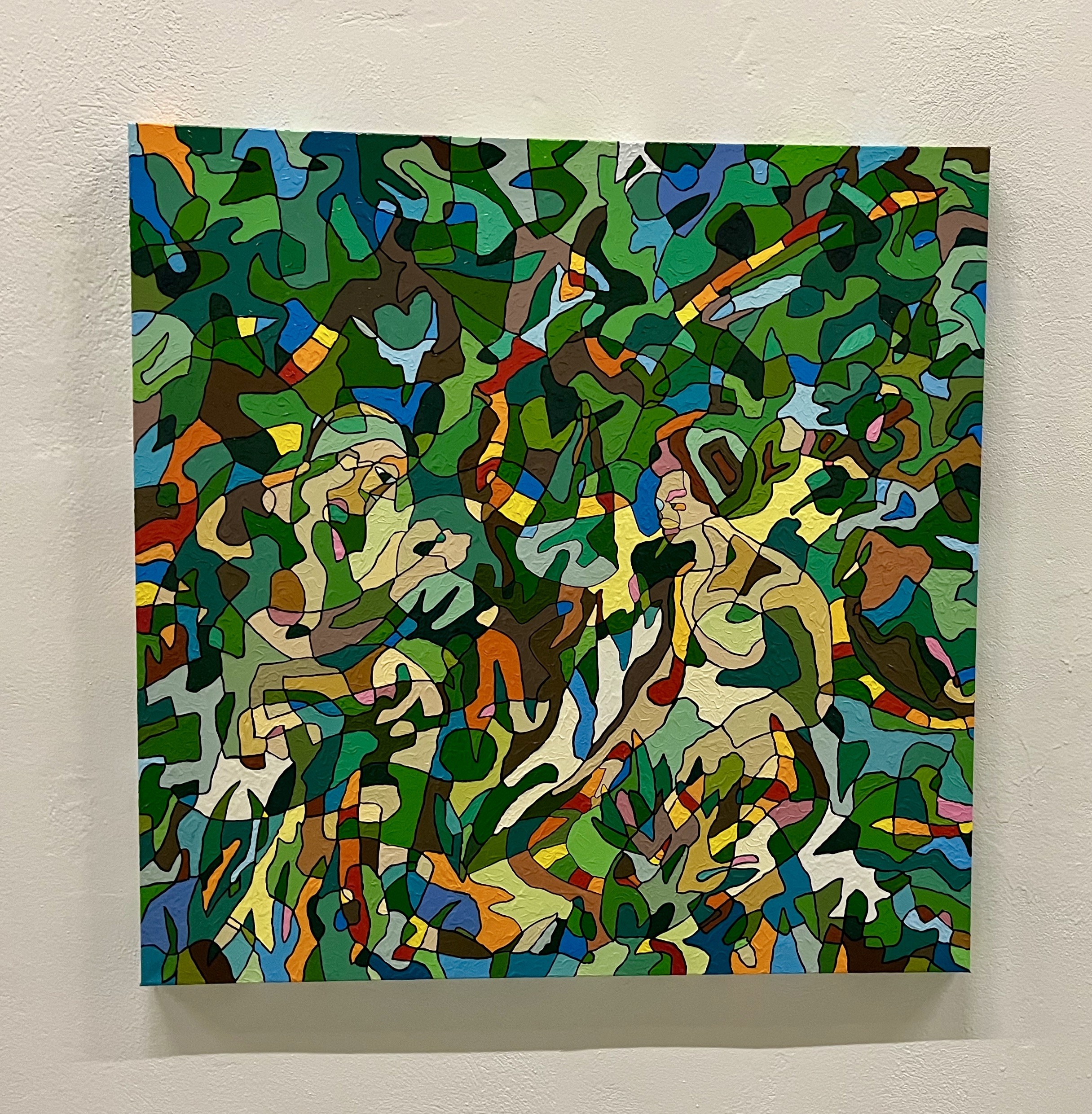 A painting on a wall in a room. 
