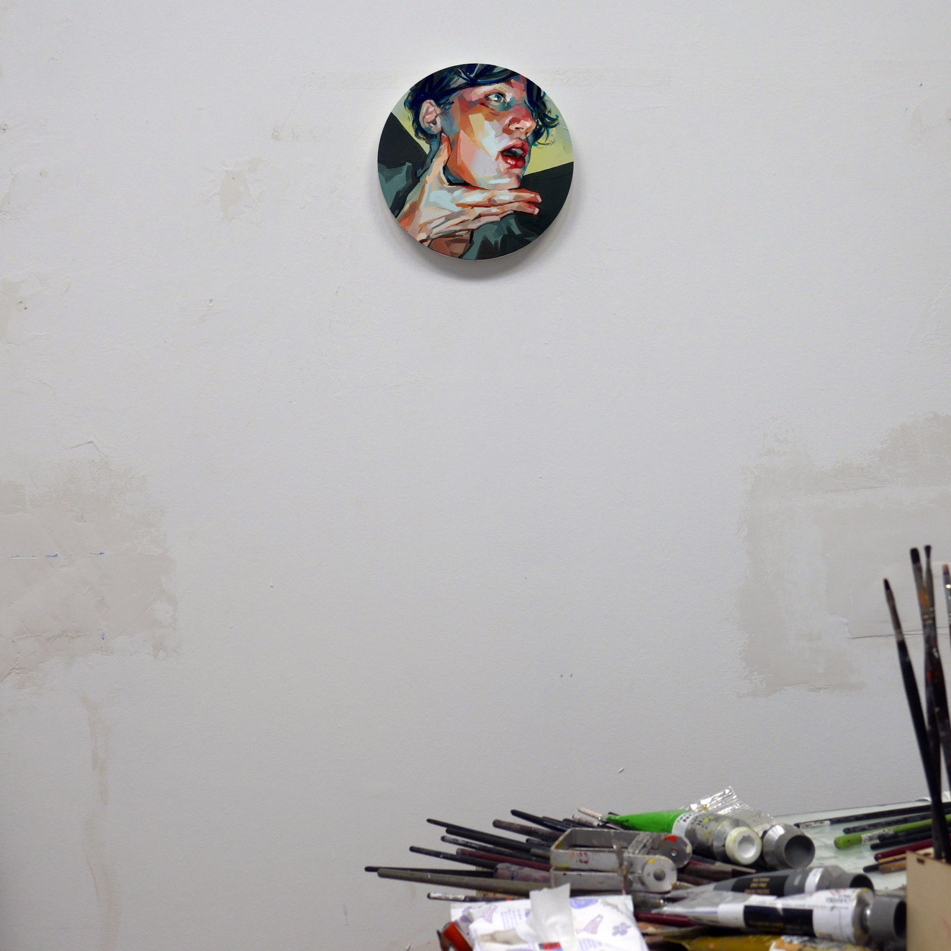 A painting of a woman with her hand on her chin.