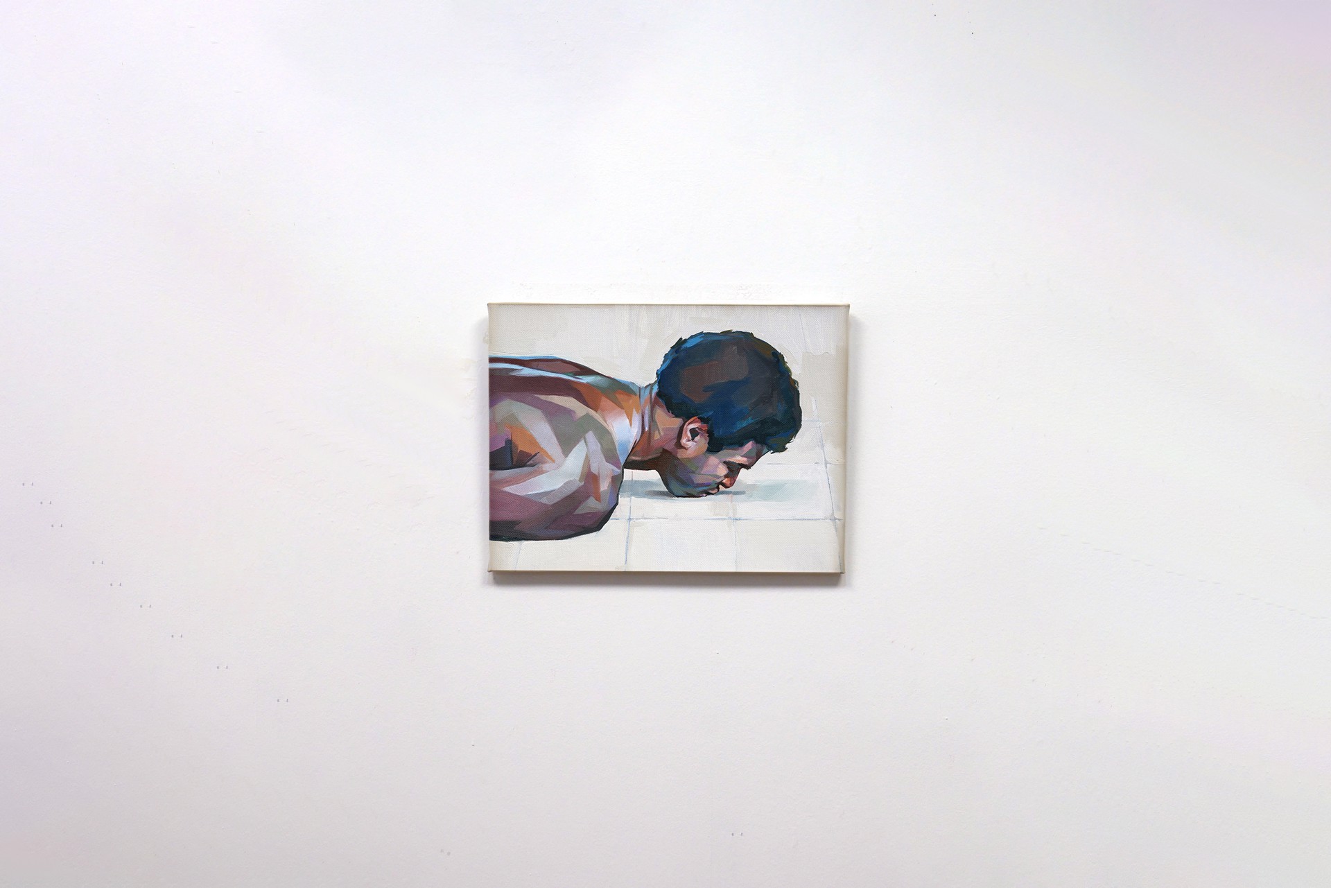 A painting of a man laying on the floor.