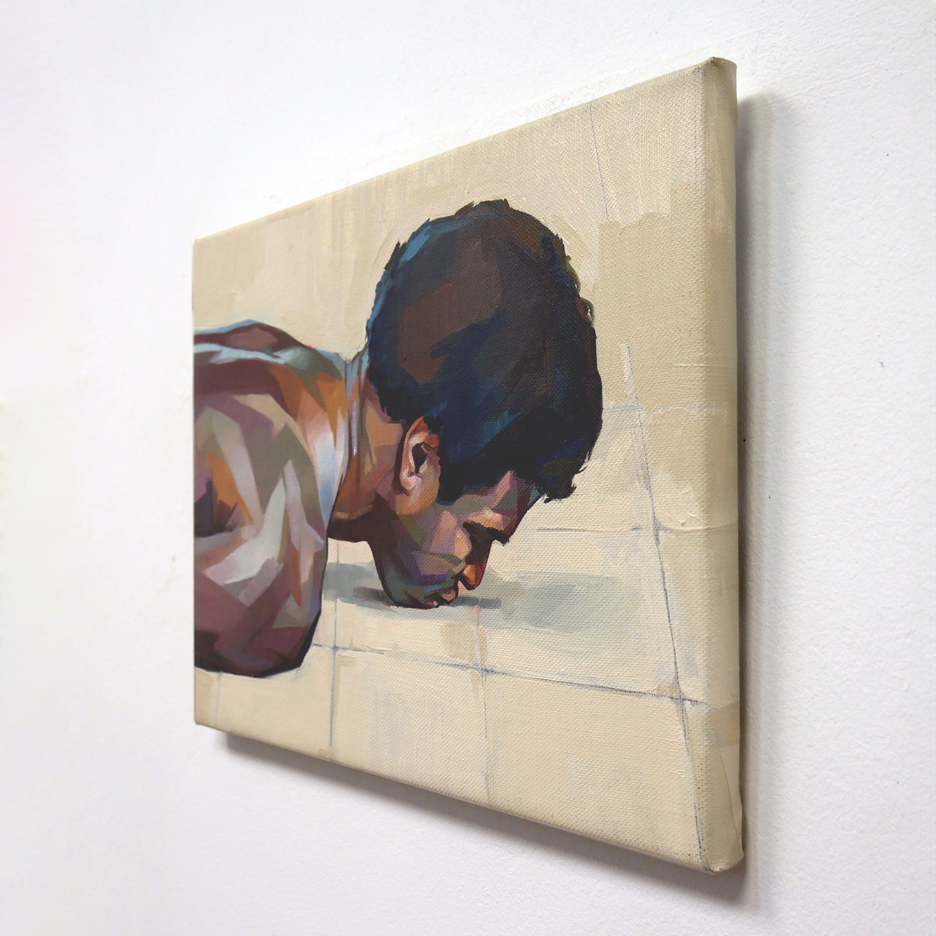 A painting of a man laying on the floor.