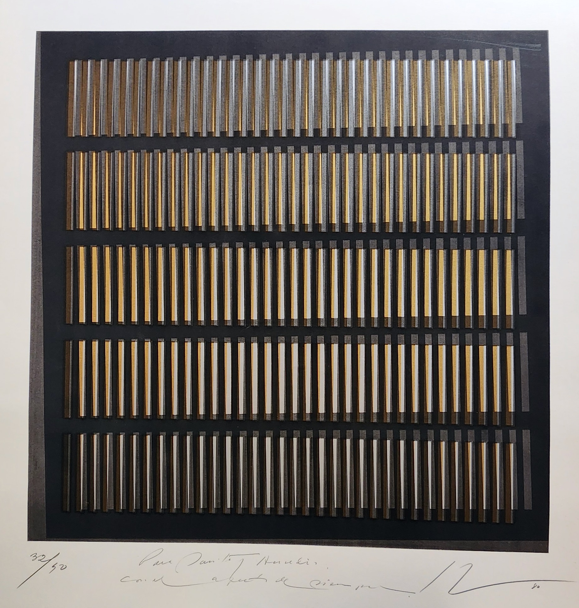 A black and gold painting on a white wall.