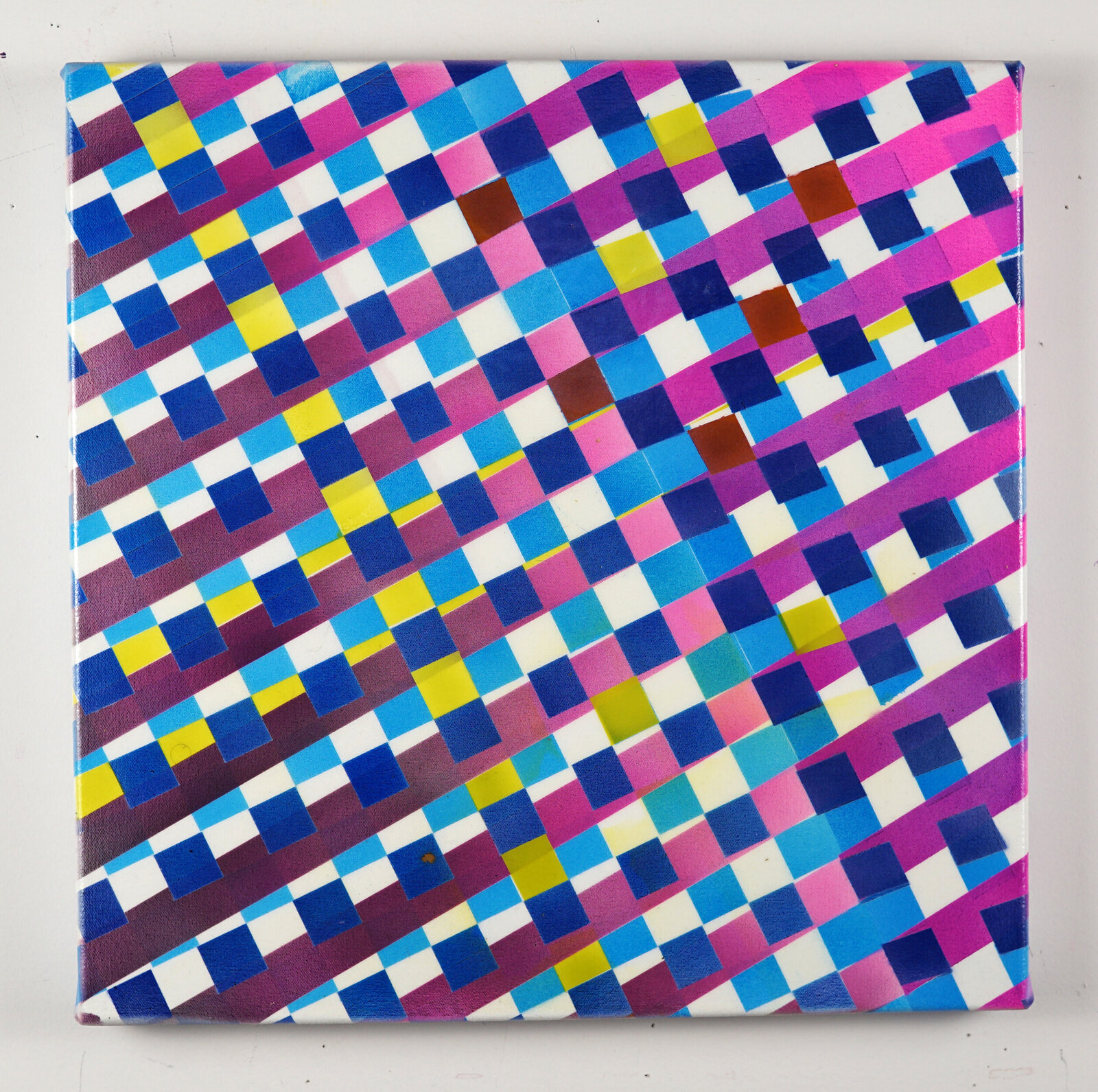 A colorful geometric abstract painting featuring a diagonal grid of squares in vibrant pinks, blues, and yellows.