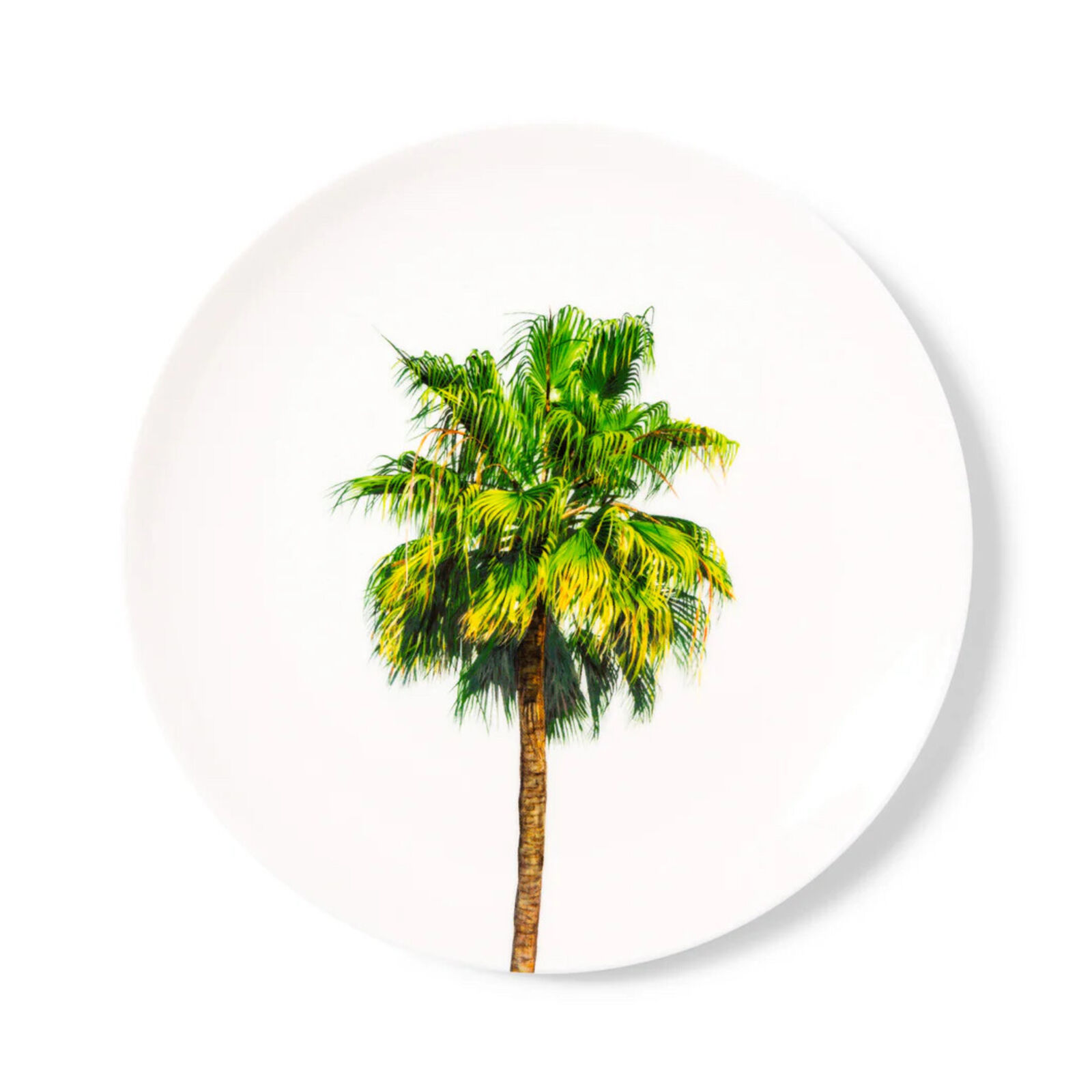 A white plate with a palm tree on it.