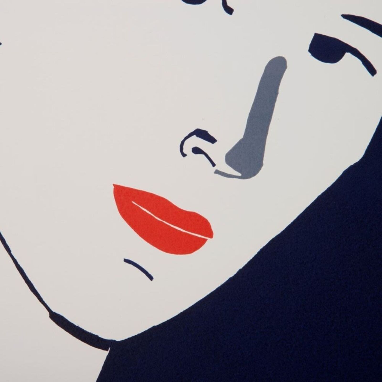 A woman standing in front of a painting on a wall.