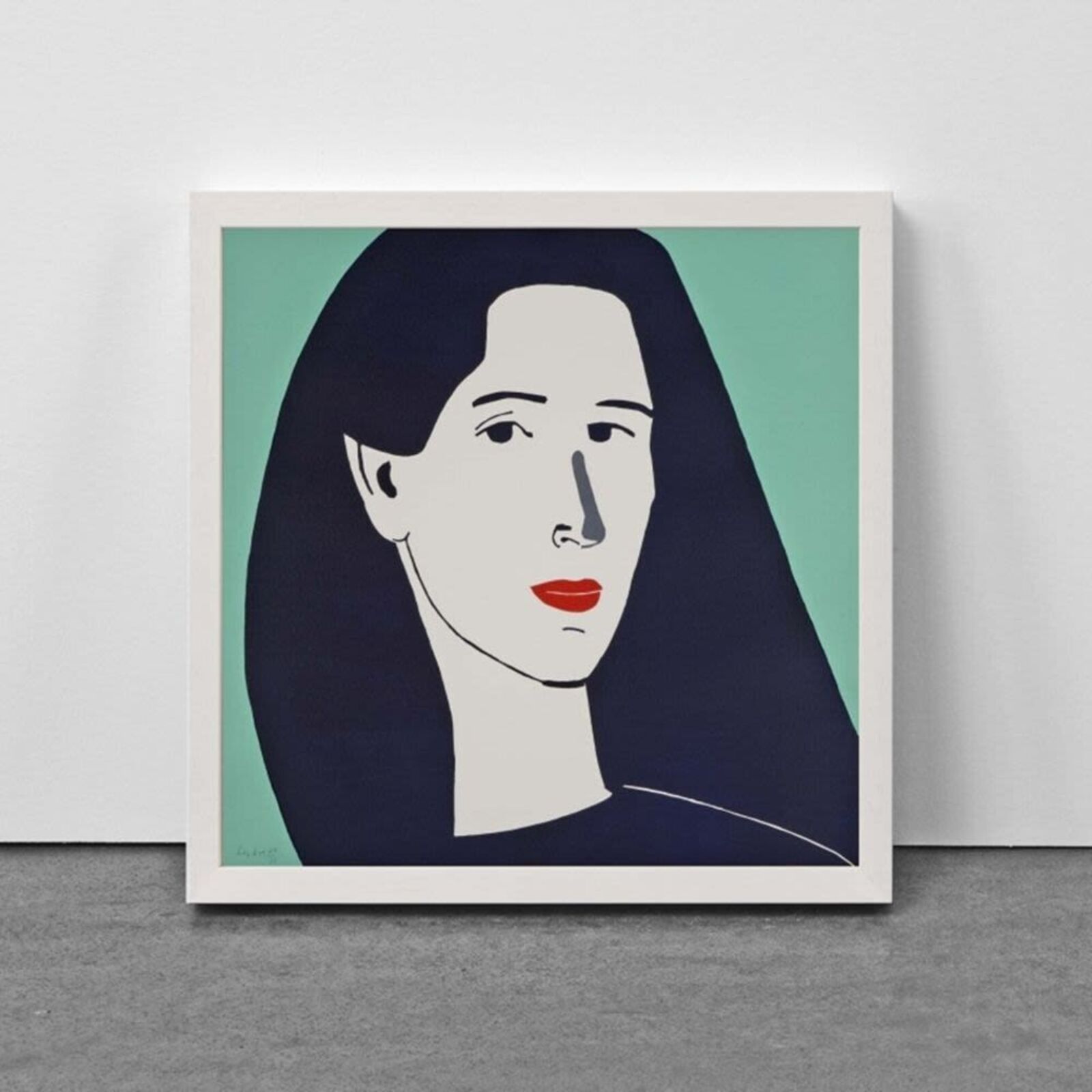 A woman standing in front of a painting on a wall.