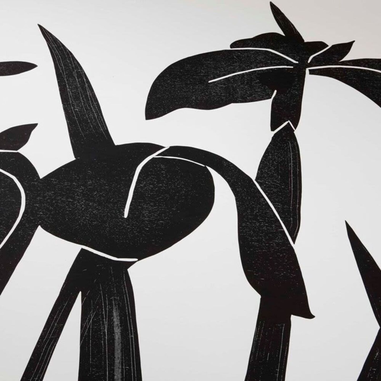 A black and white picture of a bunch of flowers on a wall.