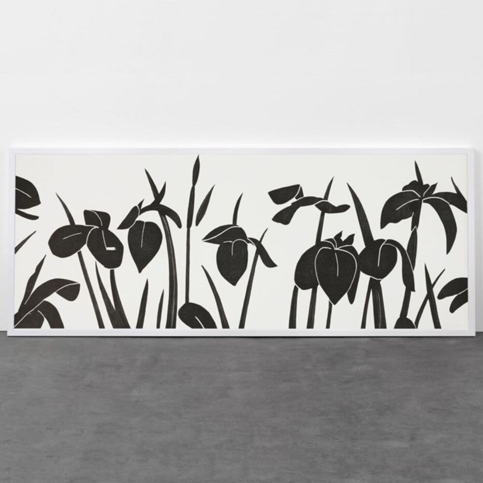 A black and white picture of a bunch of flowers on a wall.