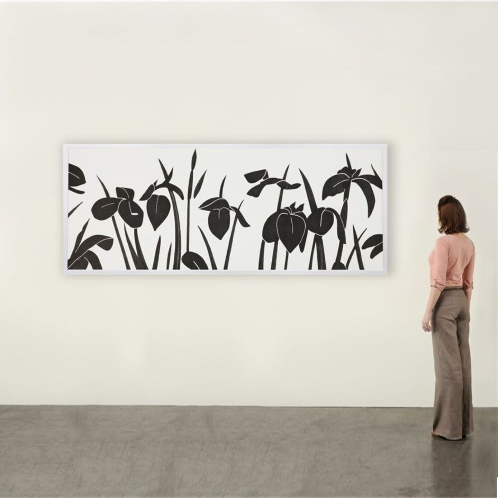 A black and white picture of a bunch of flowers on a wall.