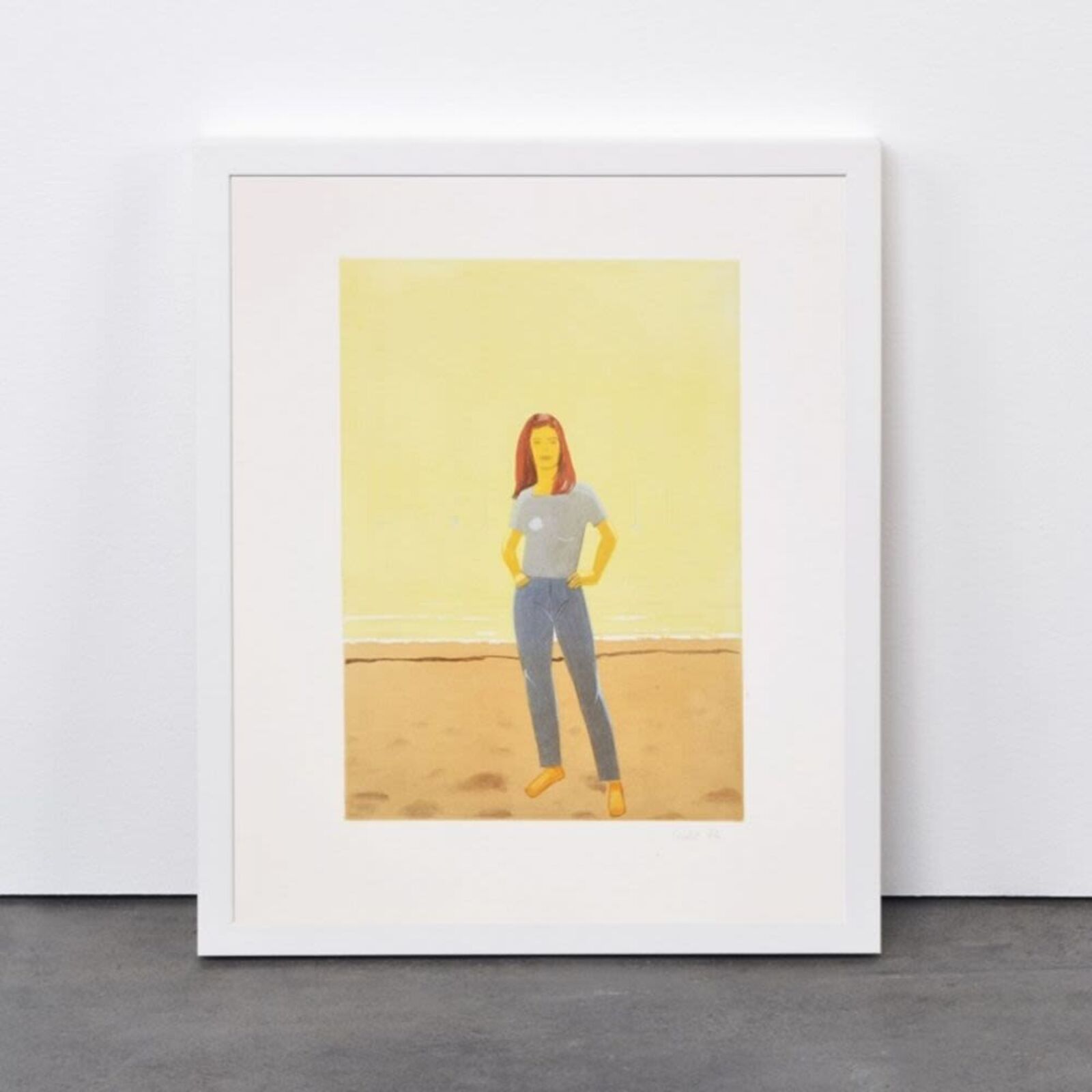 A woman standing in front of a painting on a wall.