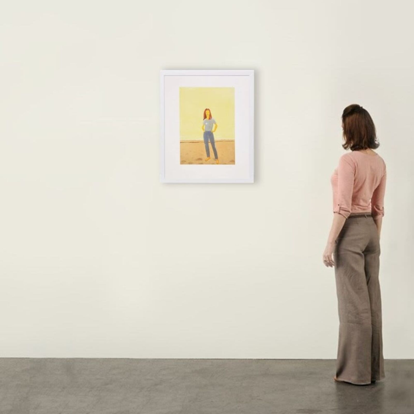 A woman standing in front of a painting on a wall.