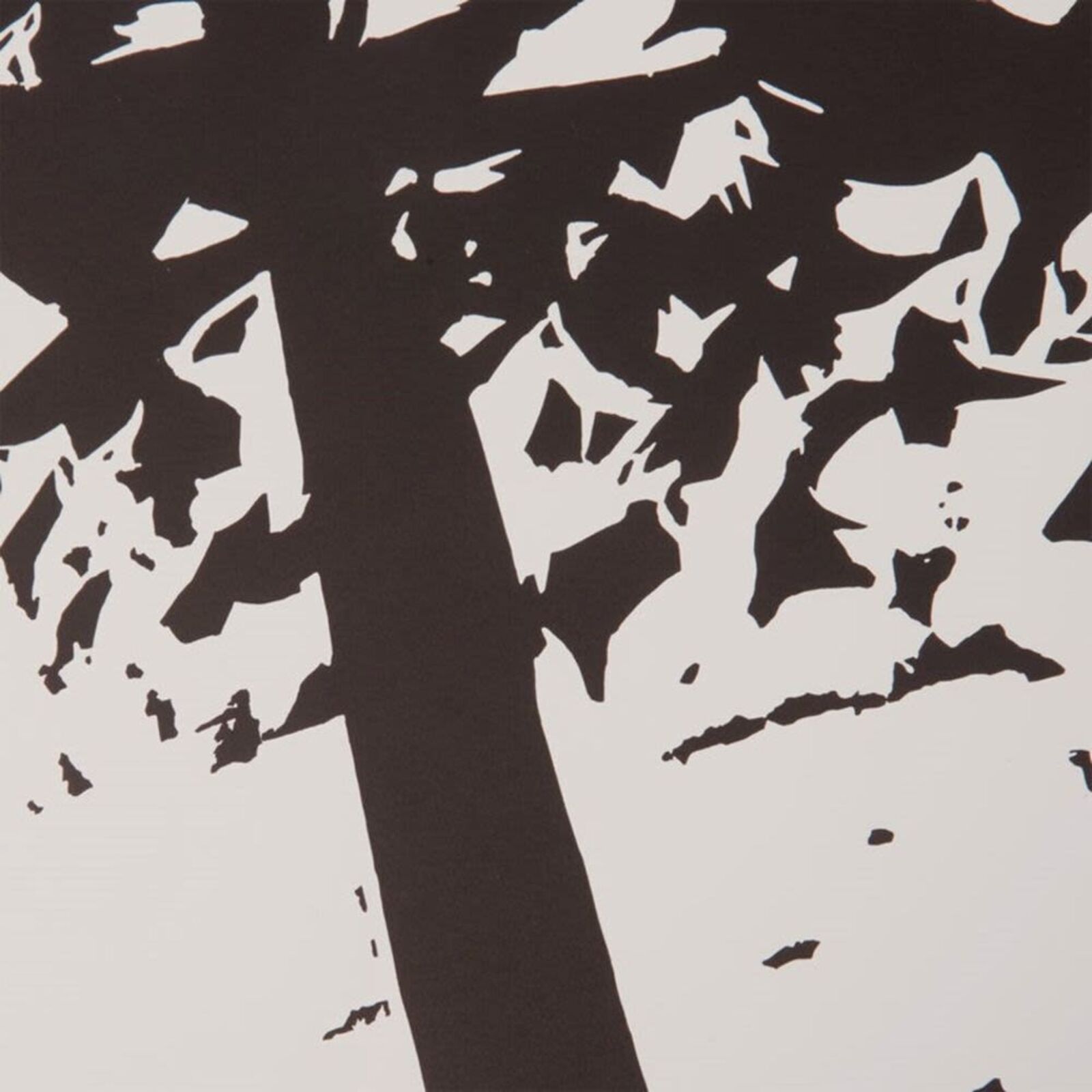 A black and white print of trees in a forest.