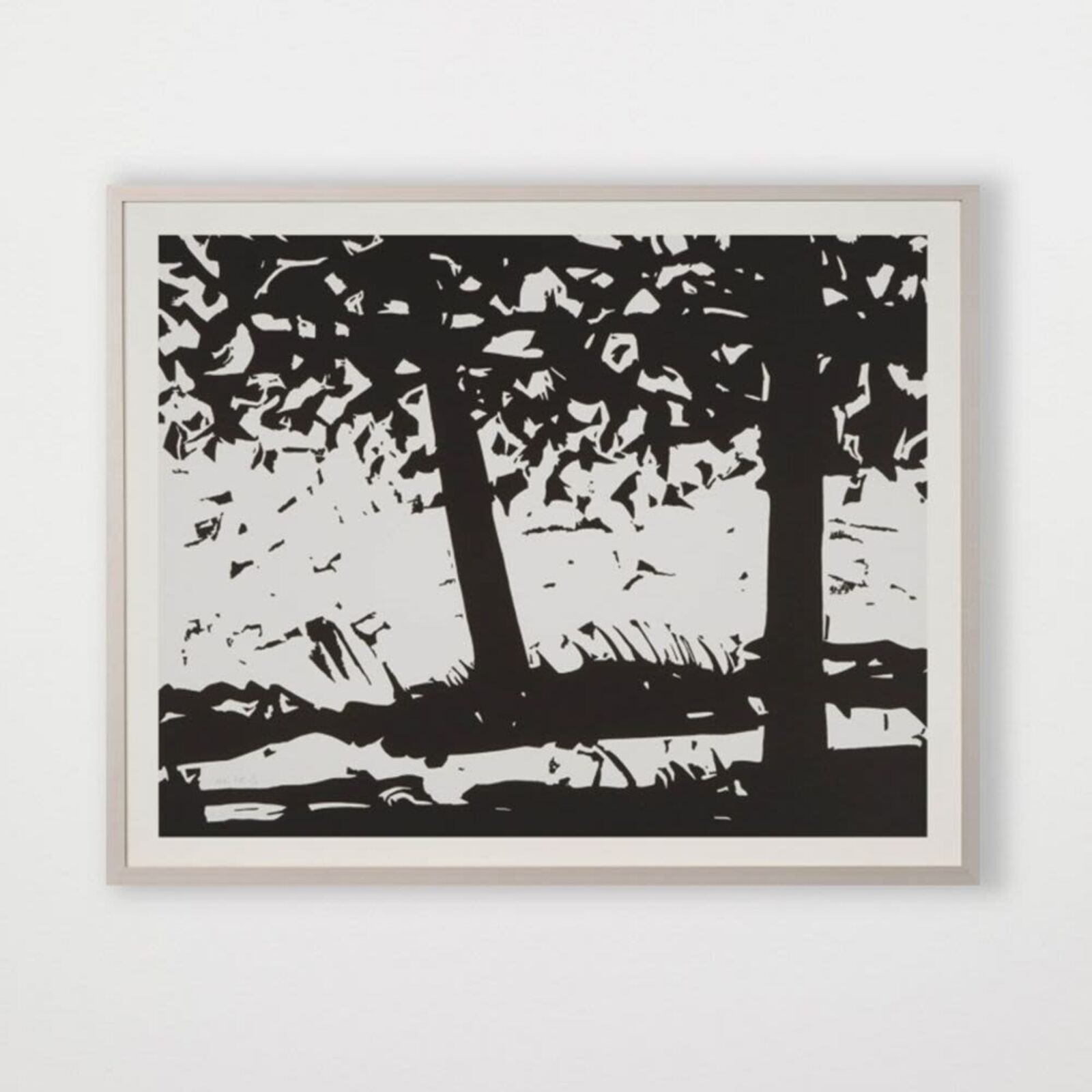 A black and white print of trees in a forest.