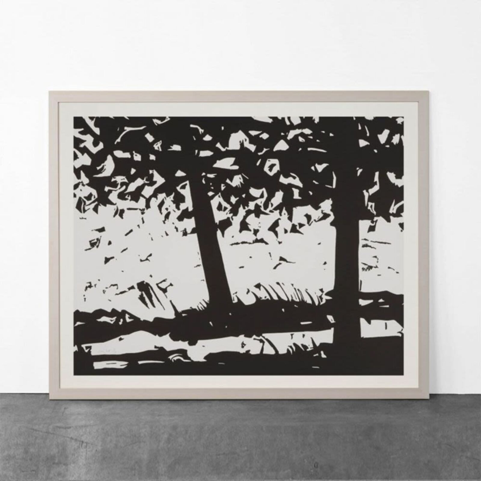A black and white print of trees in a forest.