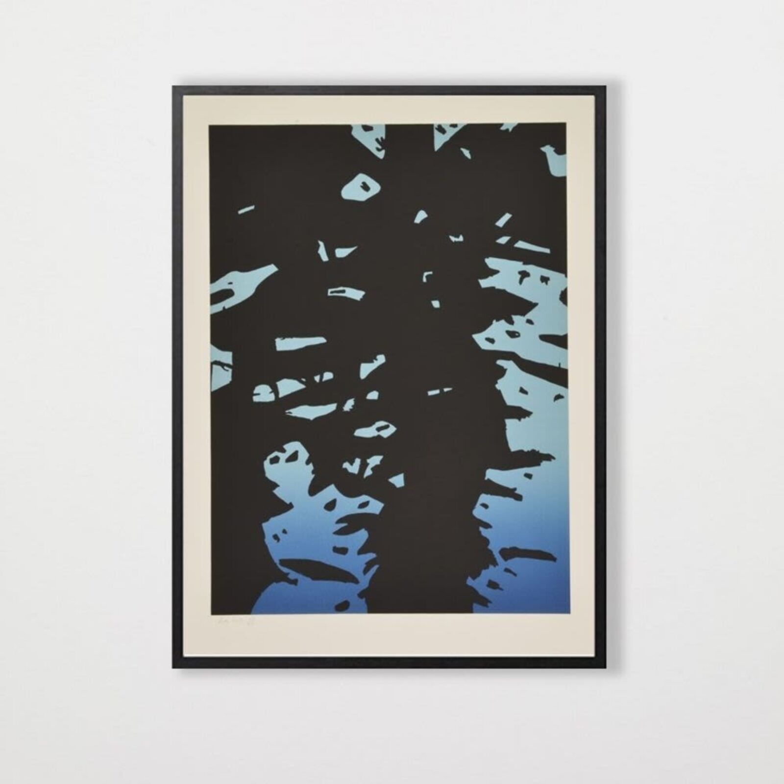 A black and blue print hanging on a wall.