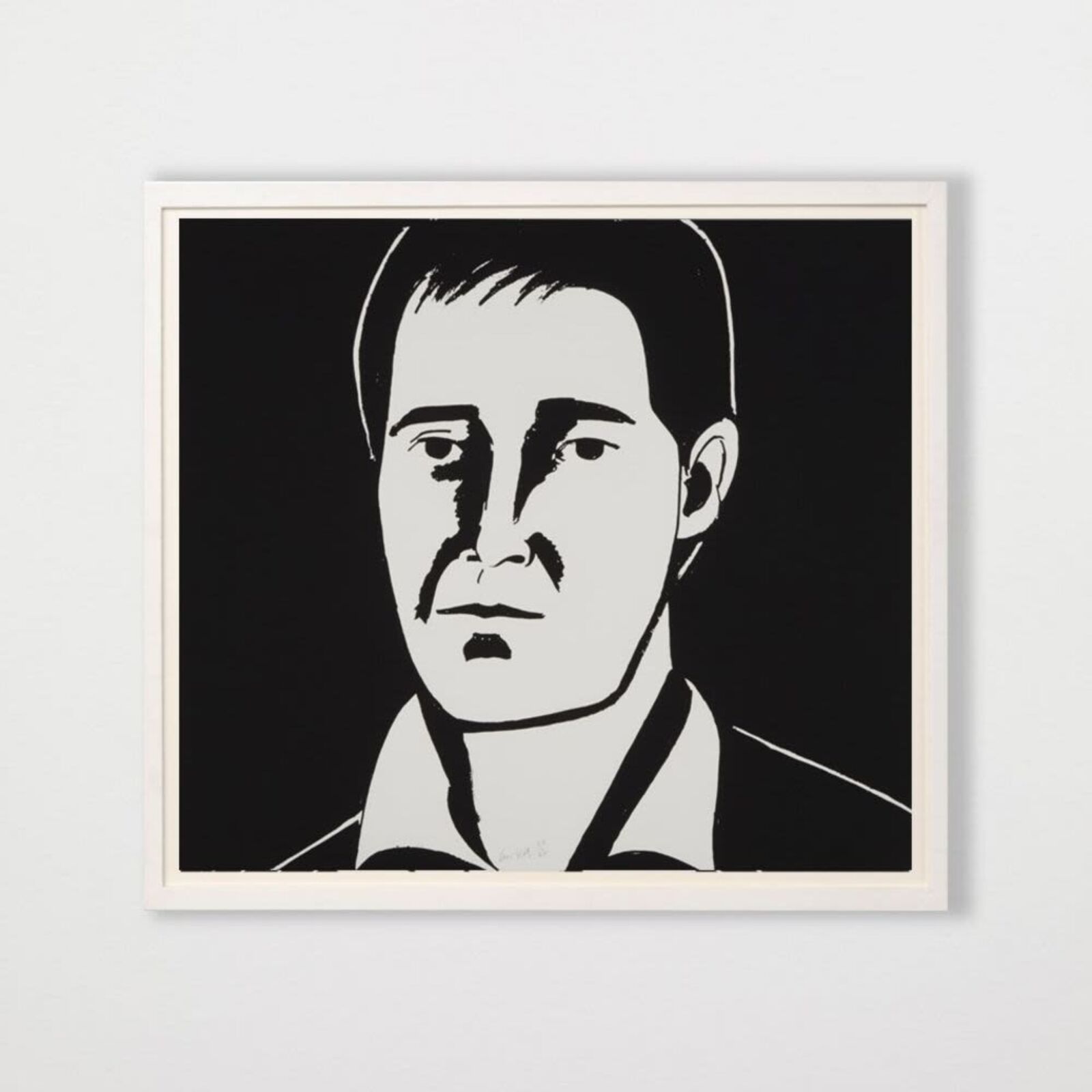 A black and white drawing of a woman's face on a wall.