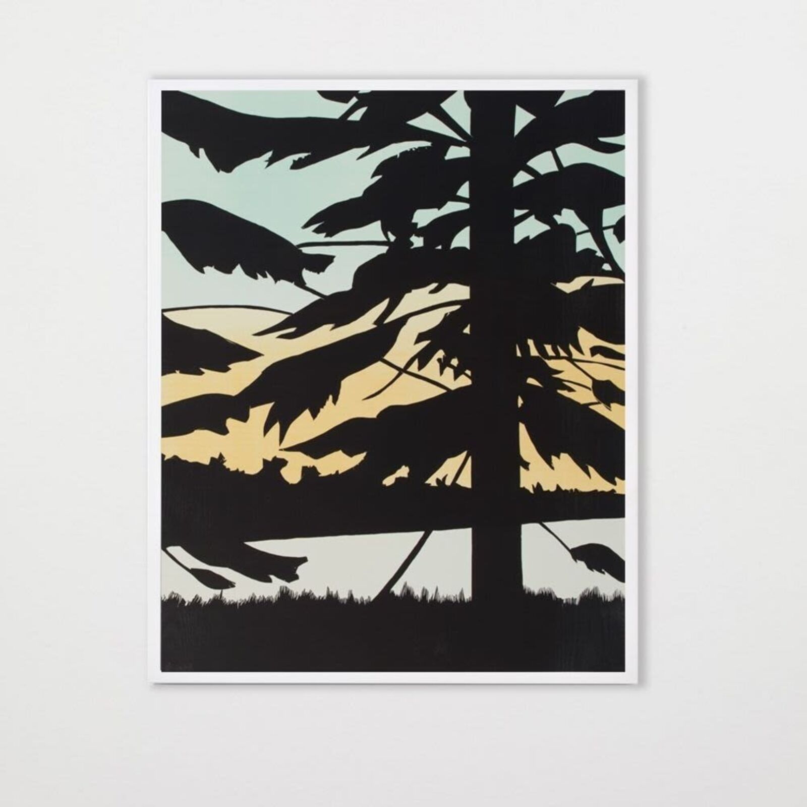 A set of three prints of a sunset with trees in the background.