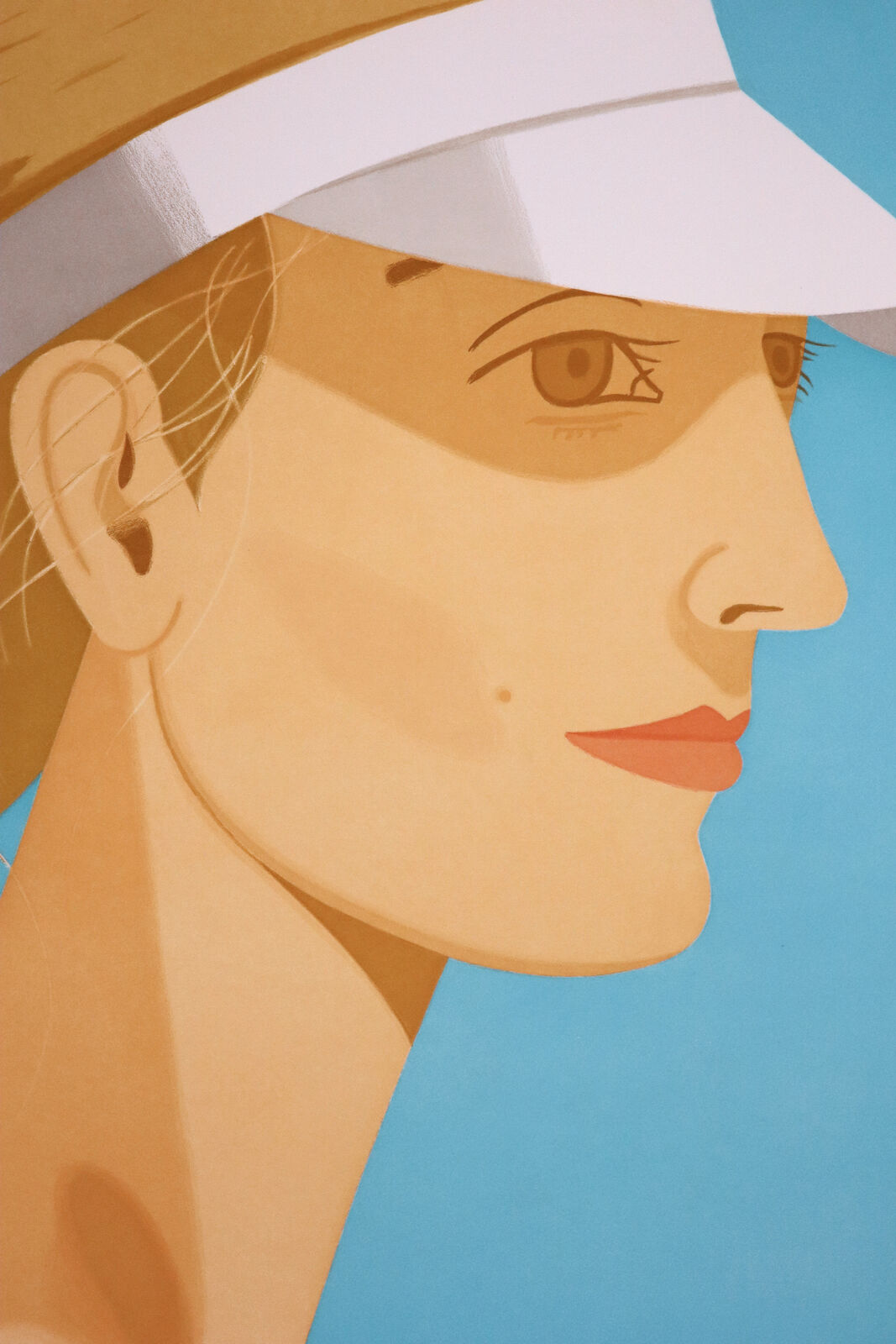 A woman wearing a white visor on a blue background.