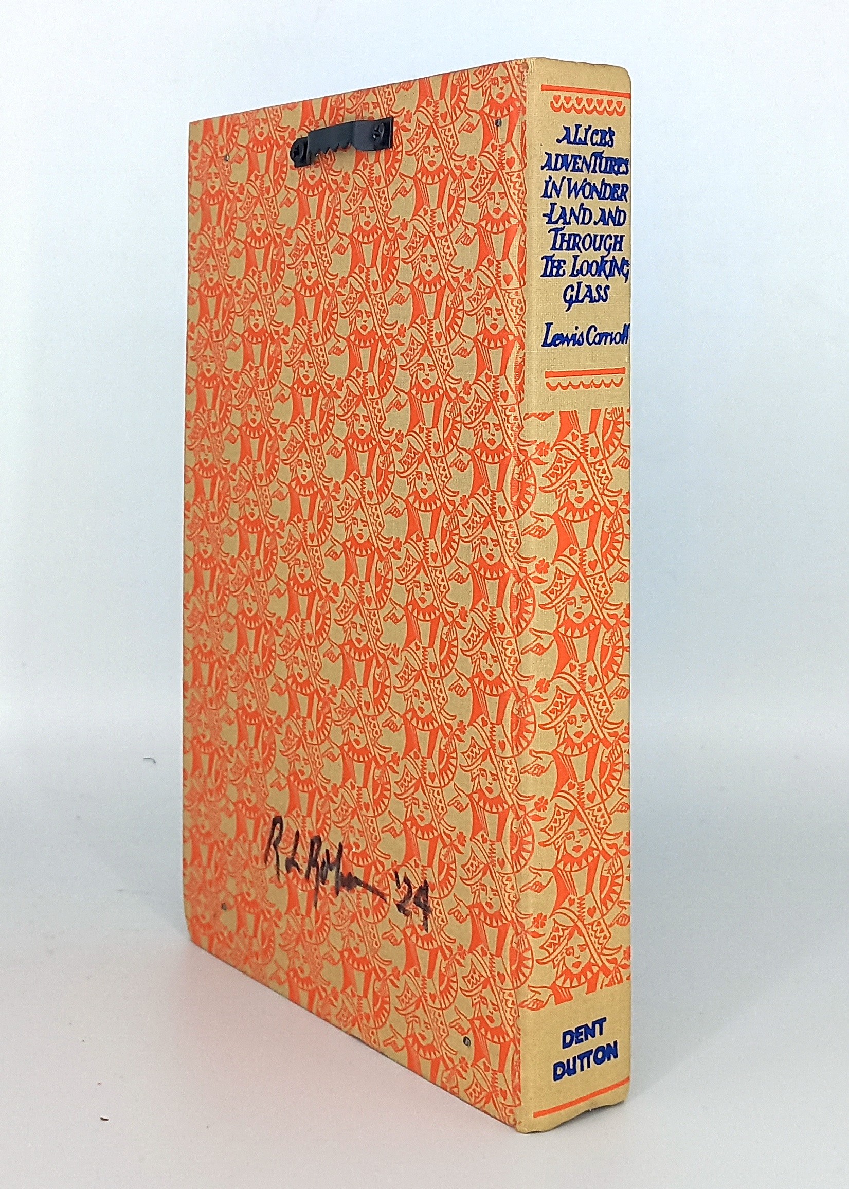 A book with a picture of Alice in Wonderland on it.