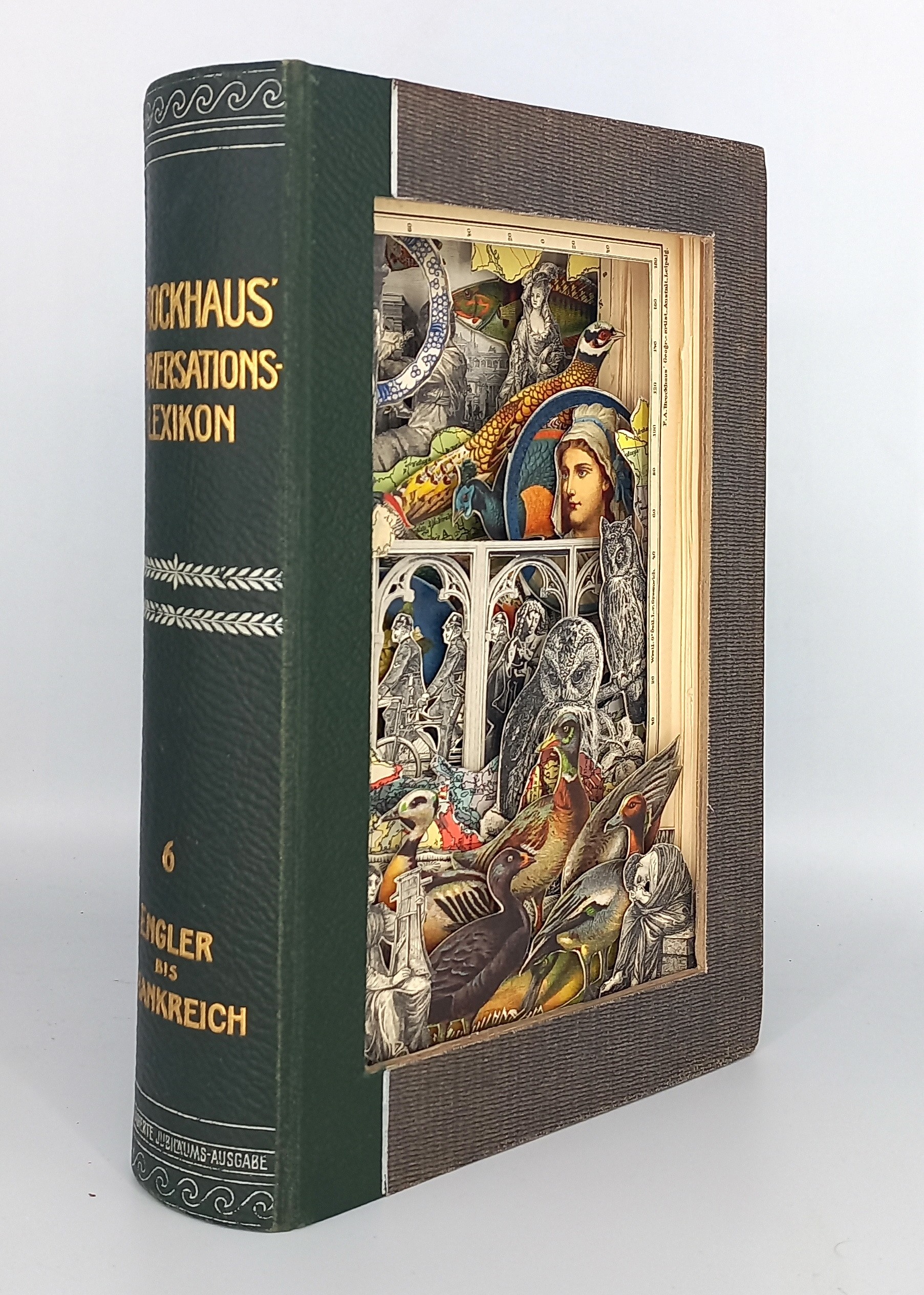 A book with a brown cover sitting on top of a white table.