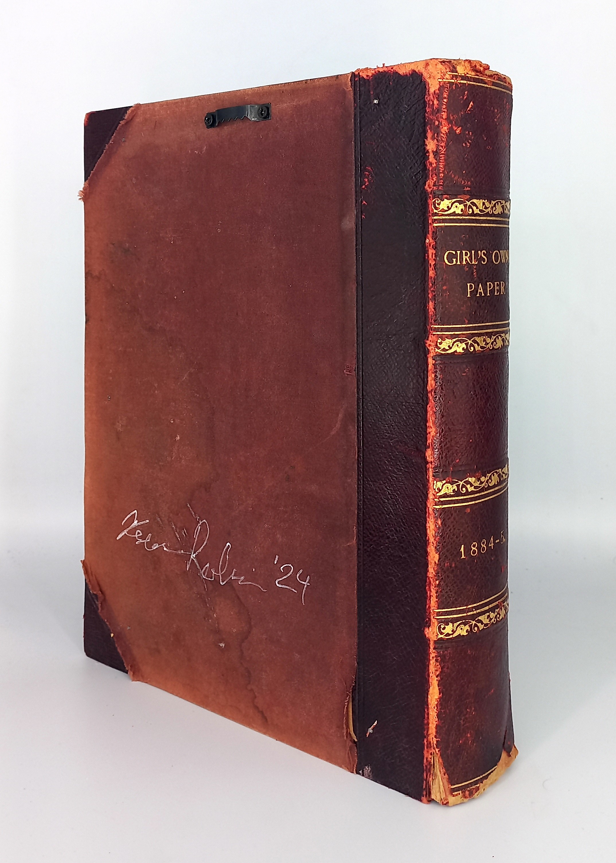 A brown book with gold lettering on the cover.