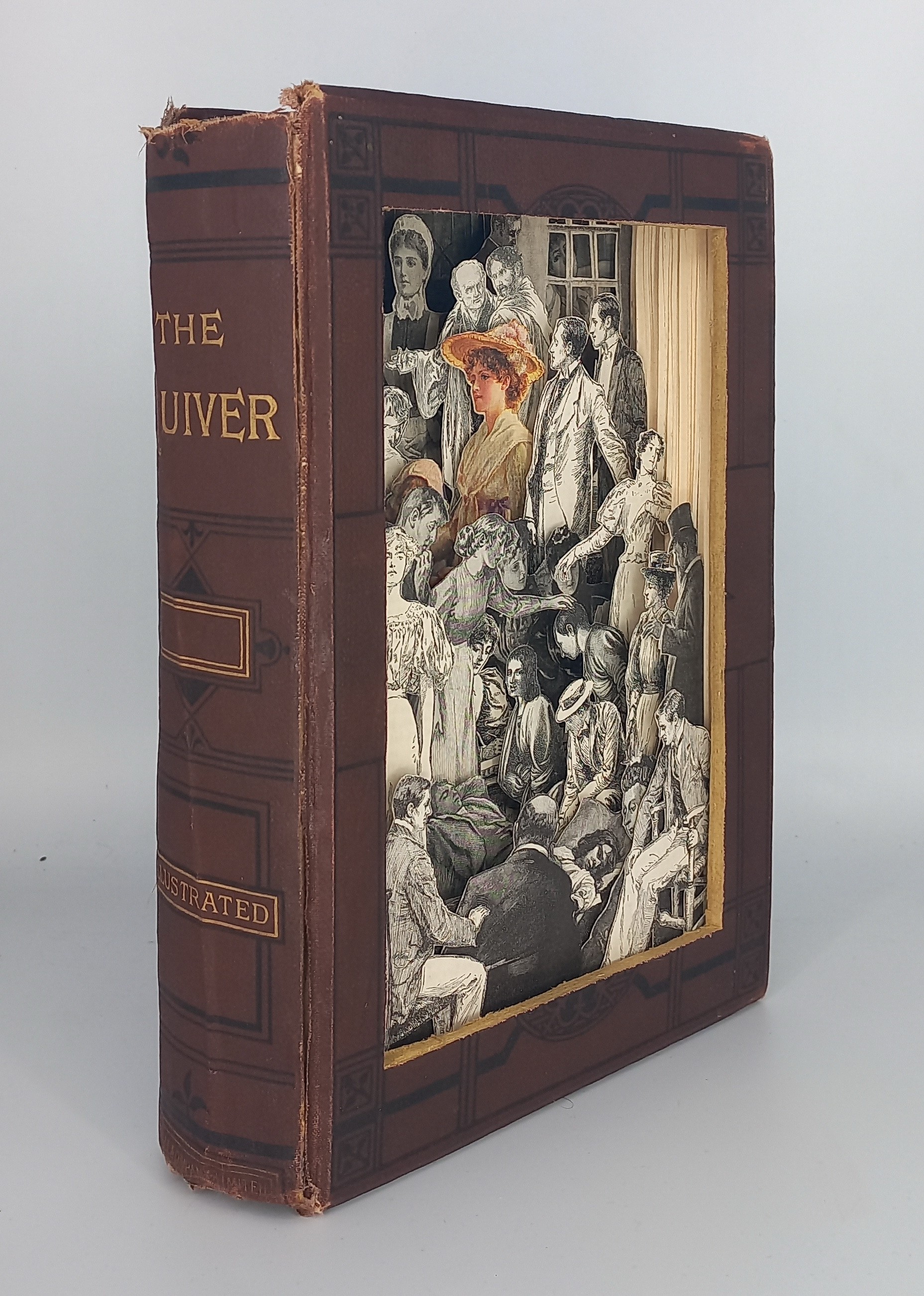 A brown book with a black and gold cover.