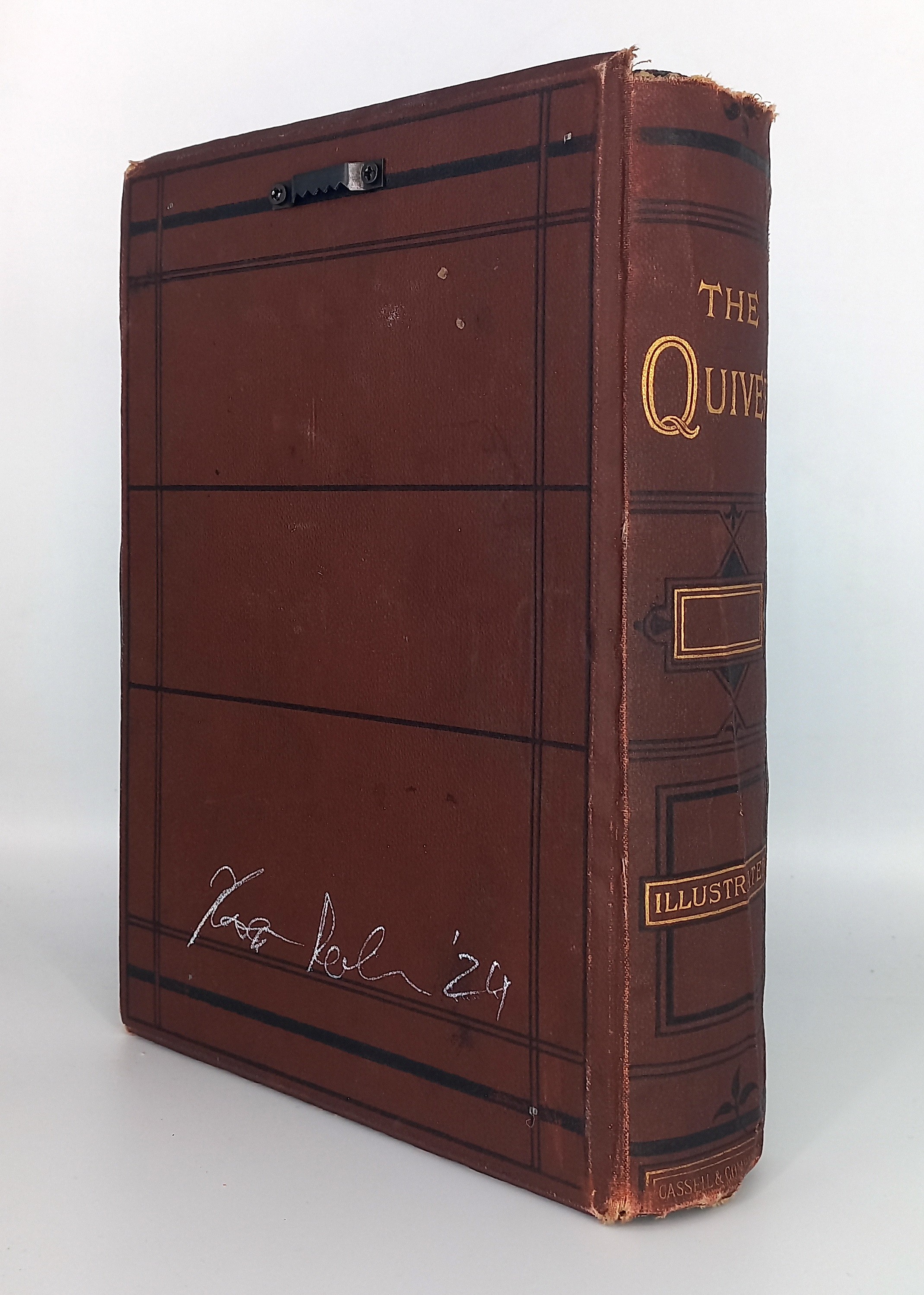 A brown book with a black and gold cover.