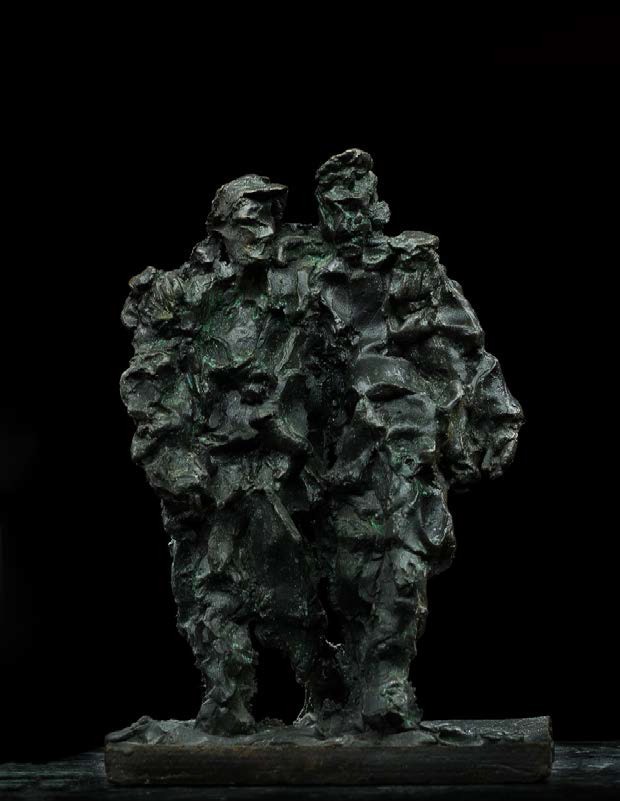 A bronze sculpture of two men standing next to each other.