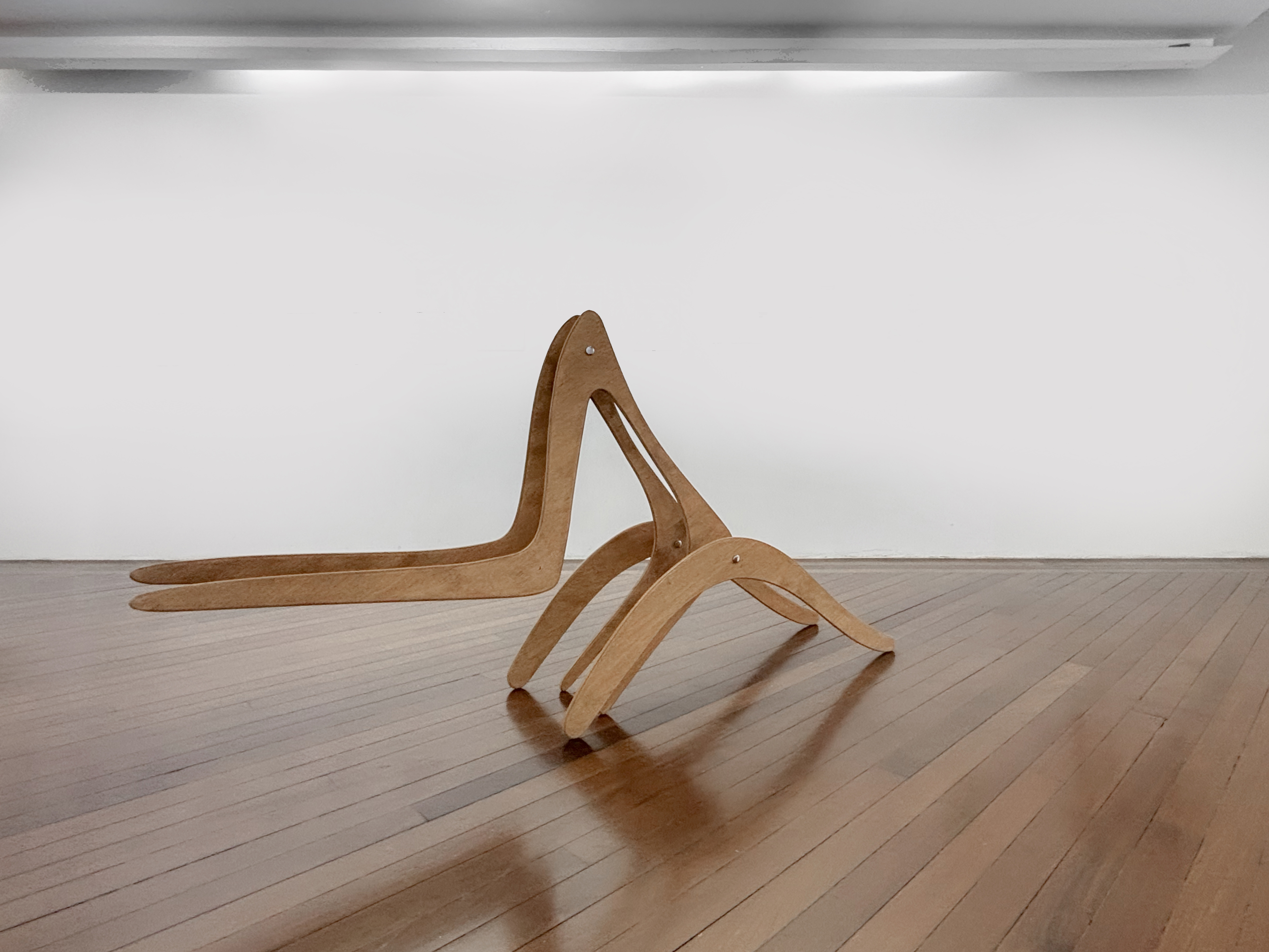 A wooden chair sitting on top of a wooden floor.